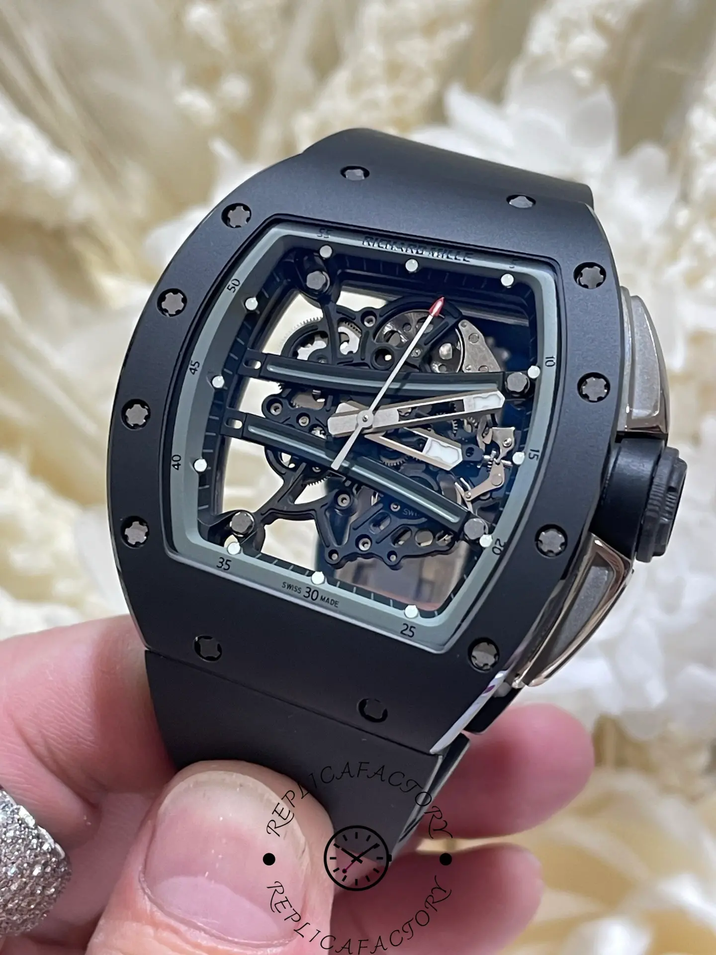 Close-up of the RM61-01 replica showing titanium hands and inner structural bridges.