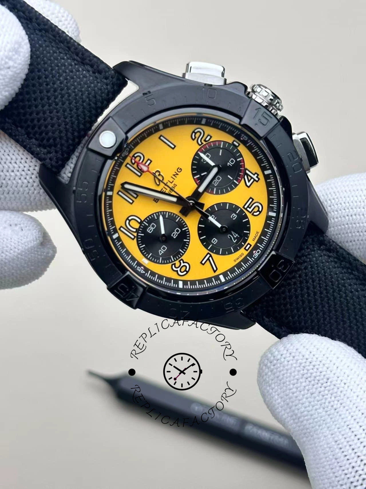 Angled view of Breitling Avenger B01 Chronograph 44 Night Mission SB0147101I1X2 with yellow dial and fabric strap.