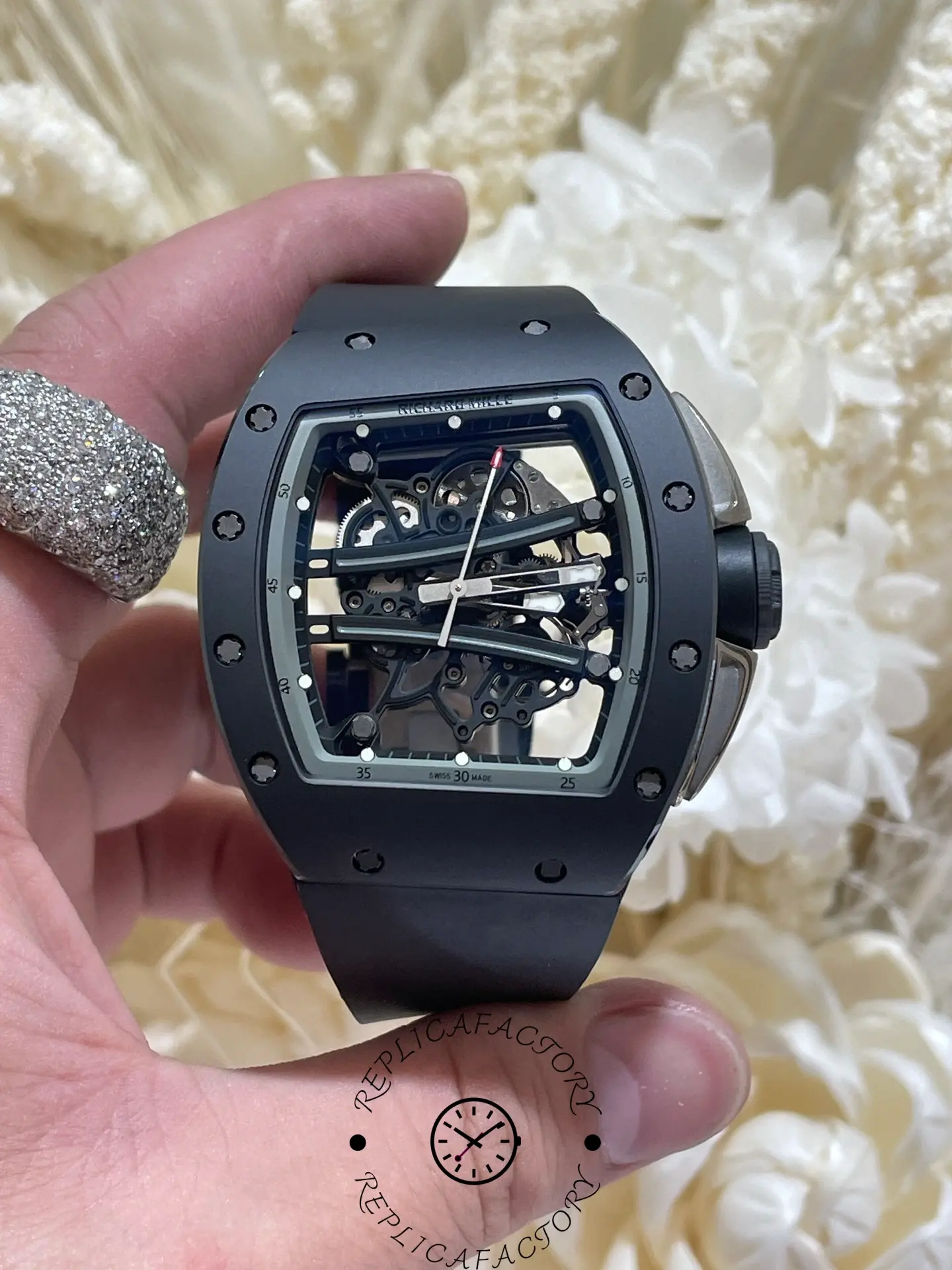 Detailed view of the RM61-01 skeleton dial with white index markers.