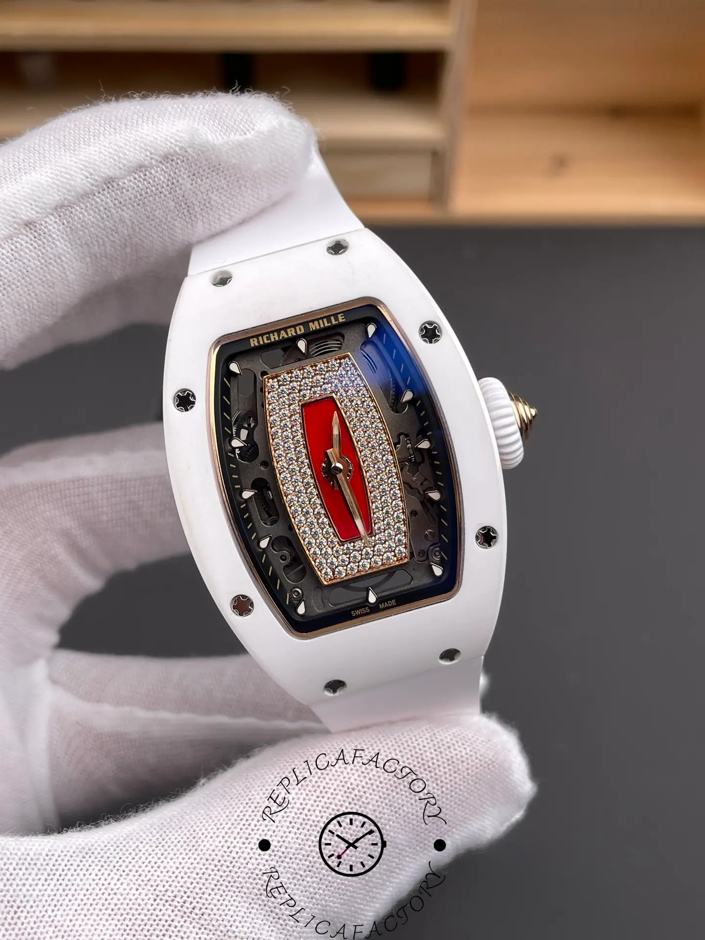 Richard Mille RM07-01 with white case and red diamond-set center bridge.