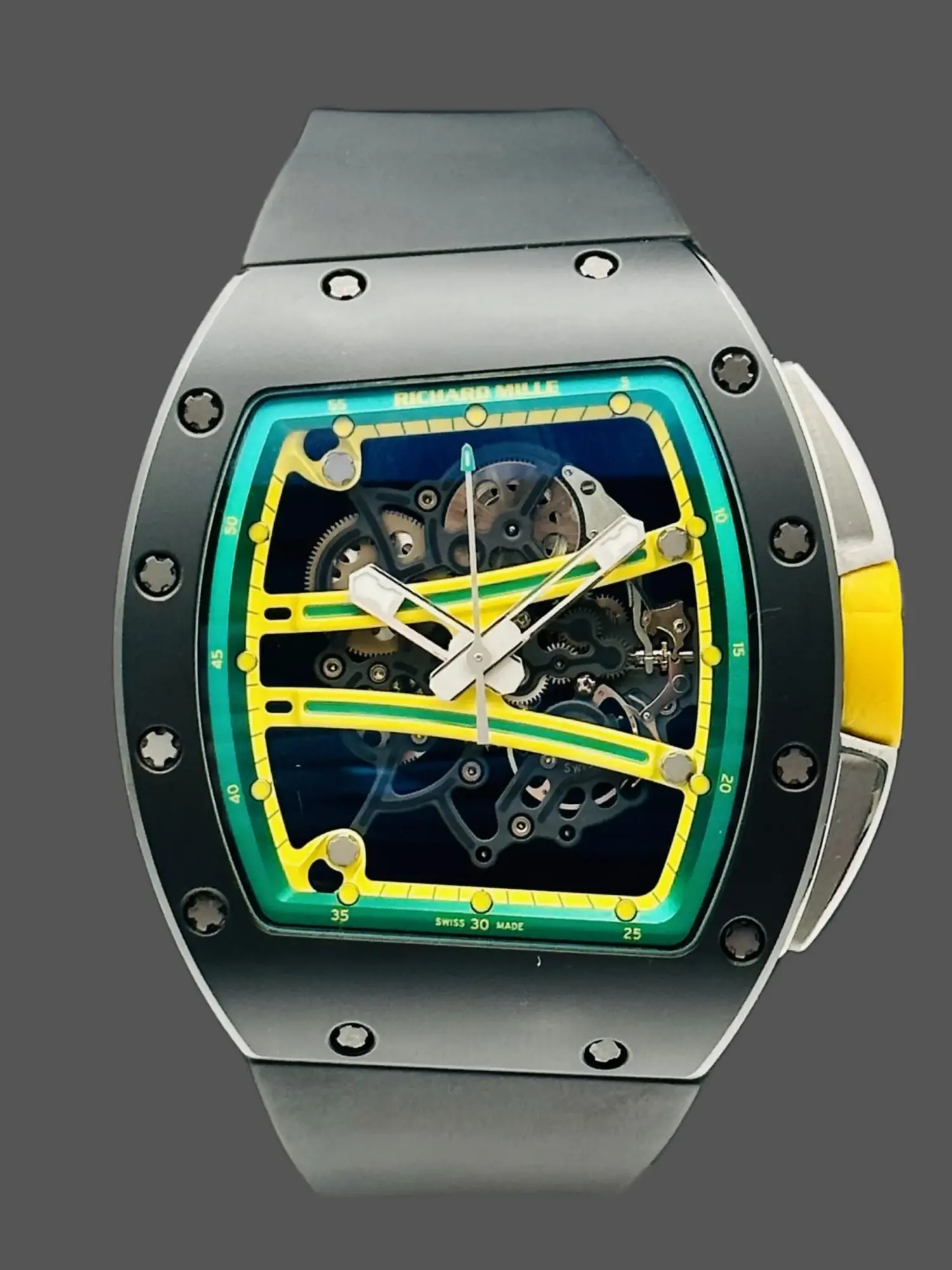 Front view of Richard Mille RM 061-01 replica showing skeleton dial with yellow and green accents.