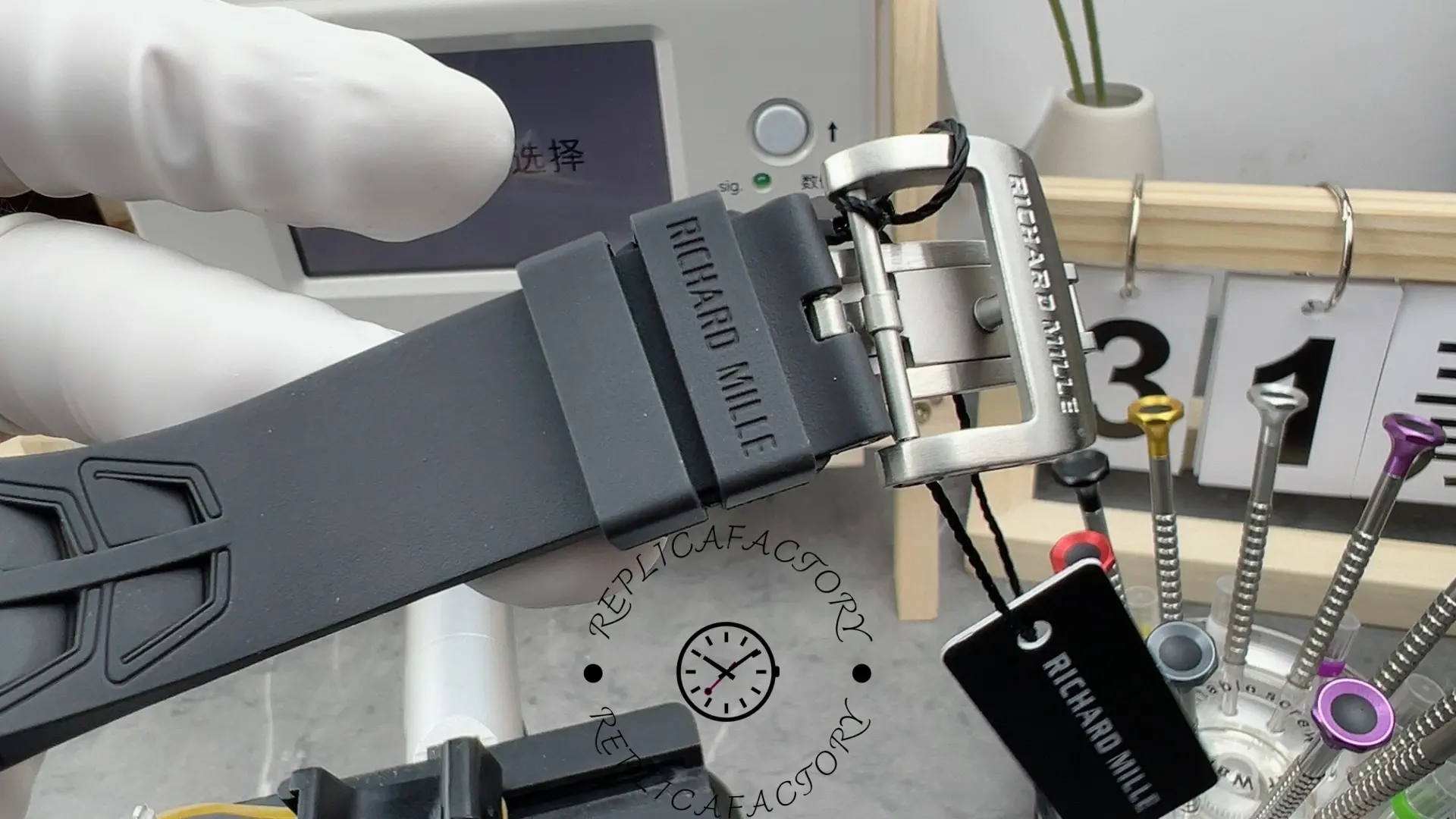 RM35-03 rubber strap and titanium clasp engraved with branding.