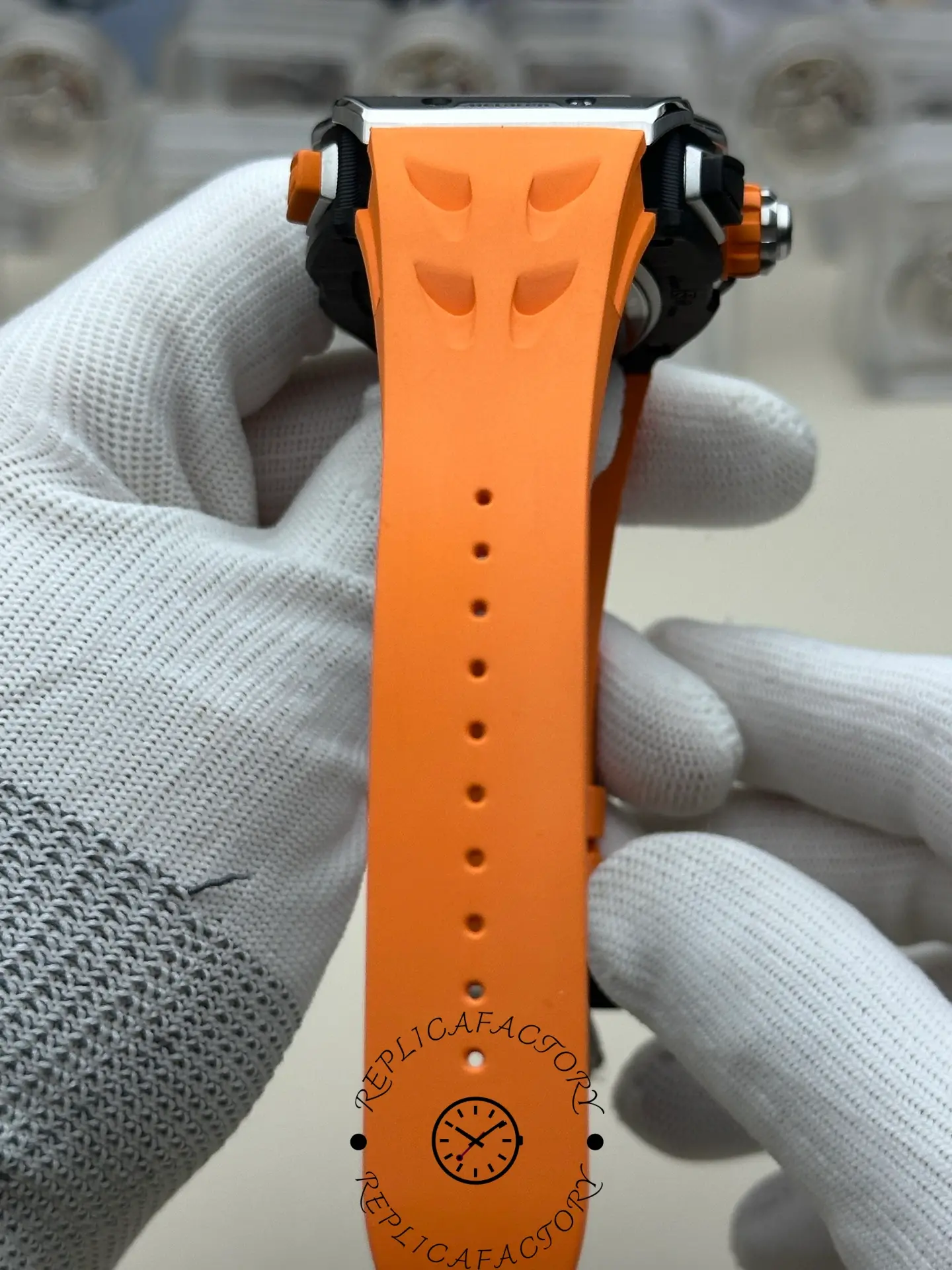 Full view of the RM 65-01 replica orange rubber strap from top angle.