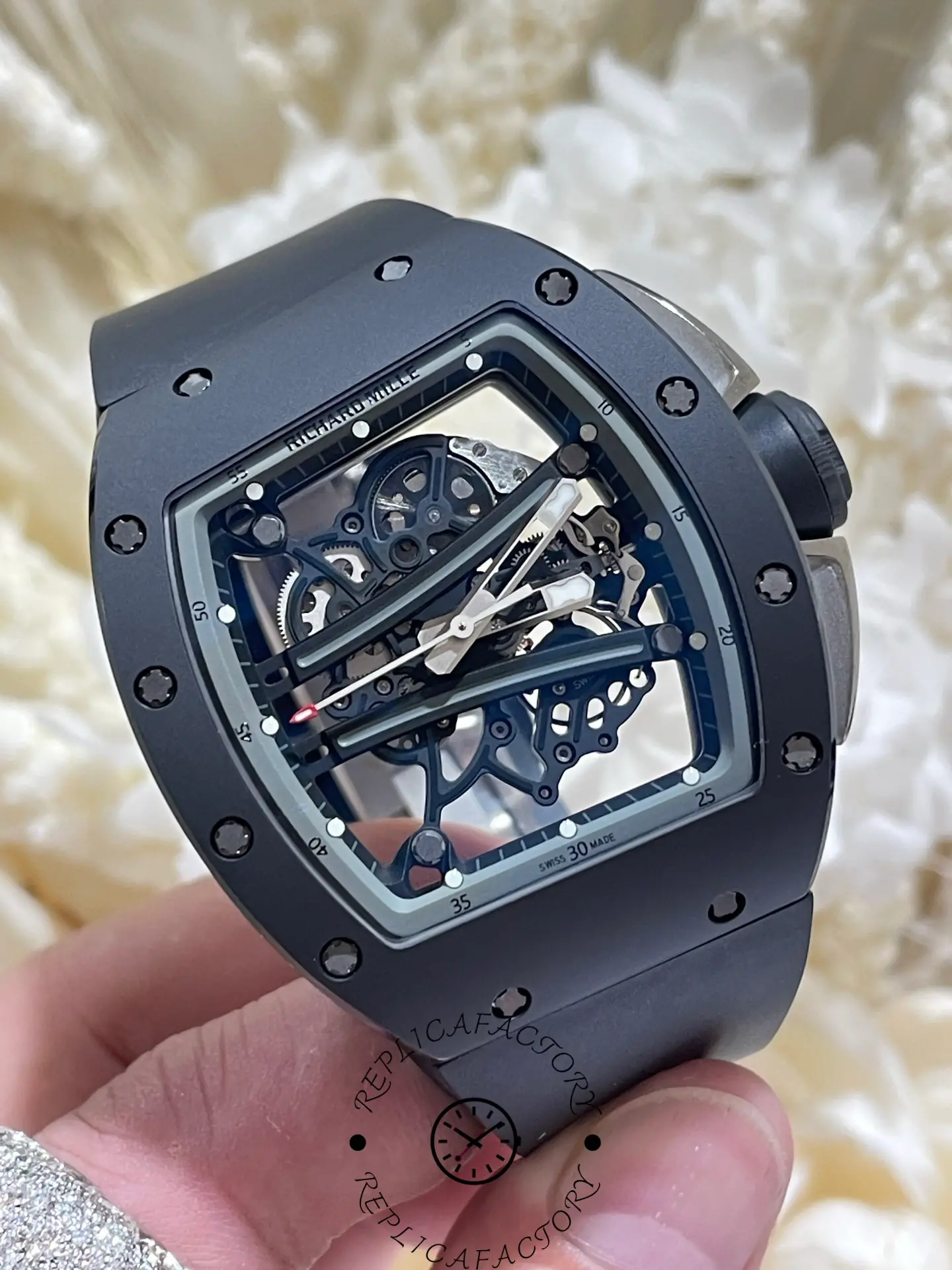 Angled view of the RM61-01 replica highlighting the open-worked movement and tonneau case.