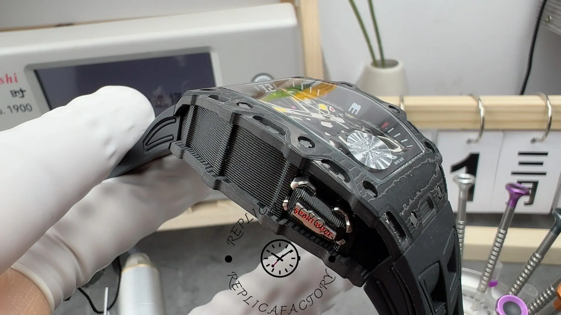 RM35-03 side view with “Sport Mode” selector and carbon-layer texture.