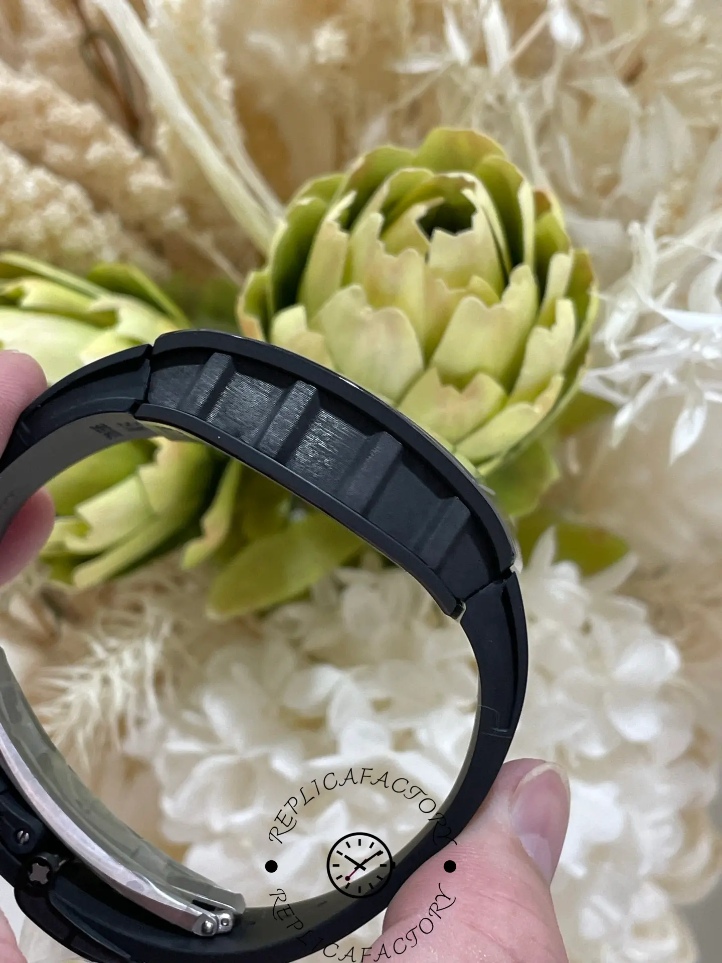 Side profile of RM 061-01 replica focusing on layered carbon case construction.