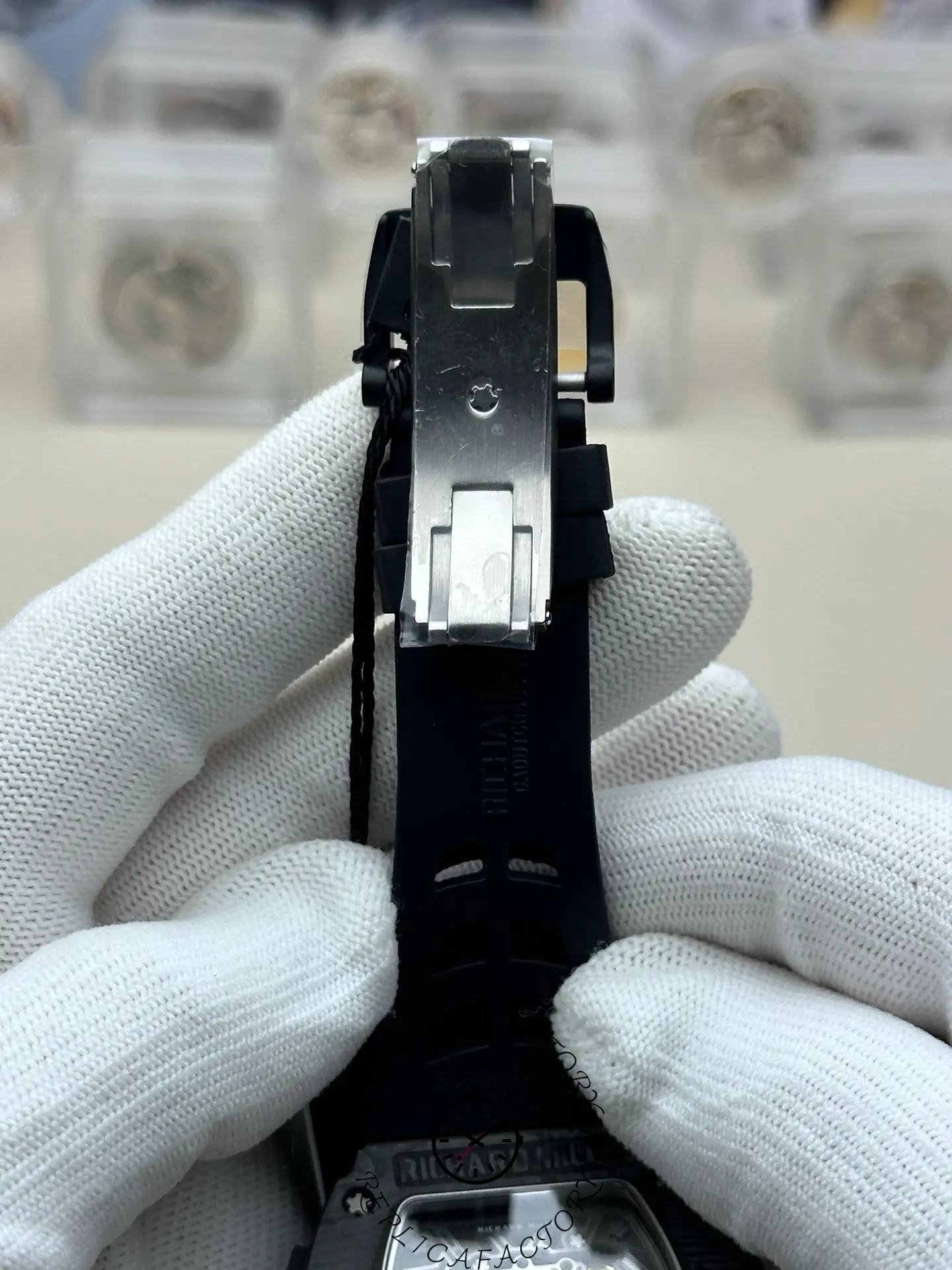 RM 65-01 replica clasp close-up showing titanium deployant buckle.