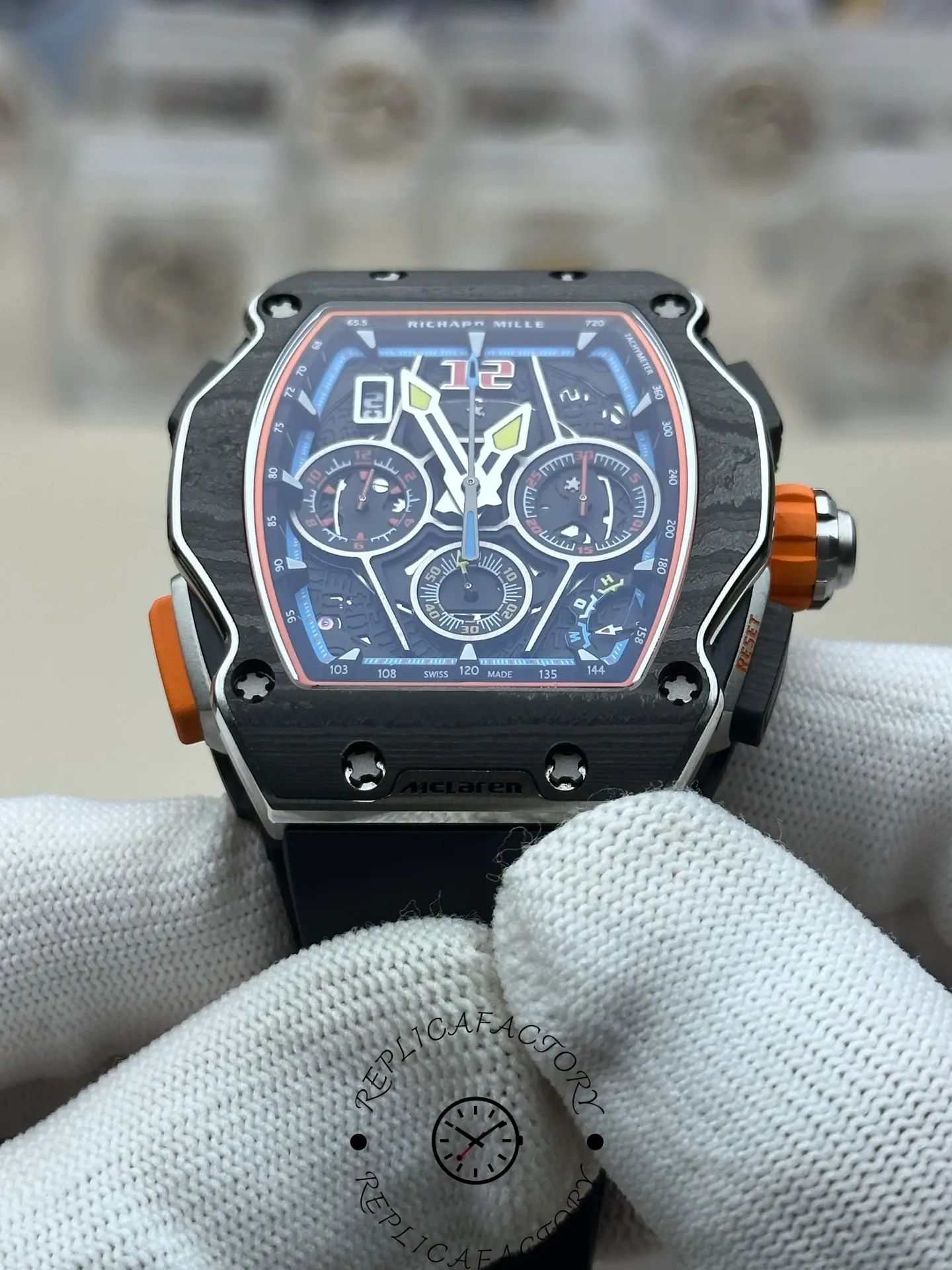 Front view of RM 65-01 replica emphasizing vivid blue and orange dial elements.
