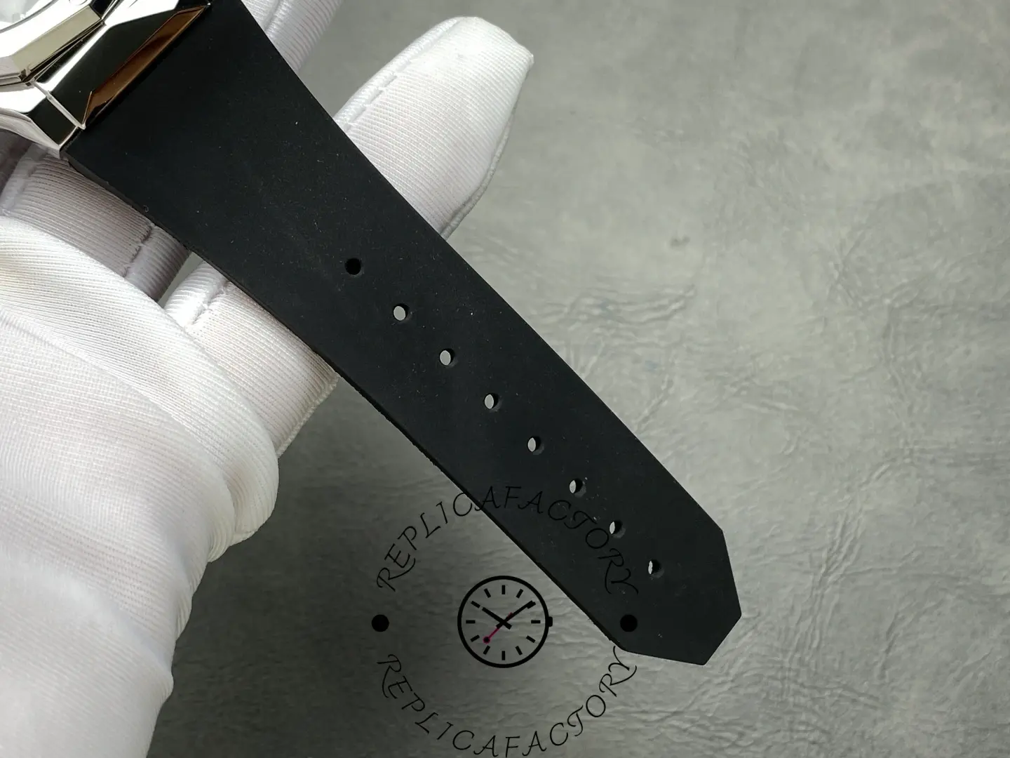 Rubber strap holes of Hublot 550.NS.1800.RX.ORL19 shown in close-up.