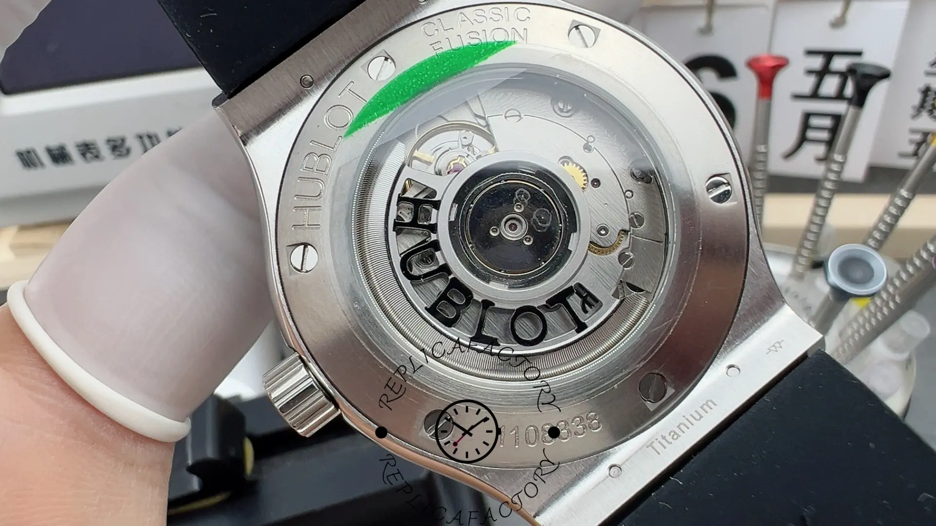 Exhibition back of the Hublot 511.NX.7071.LR replica showing rotor and movement details.