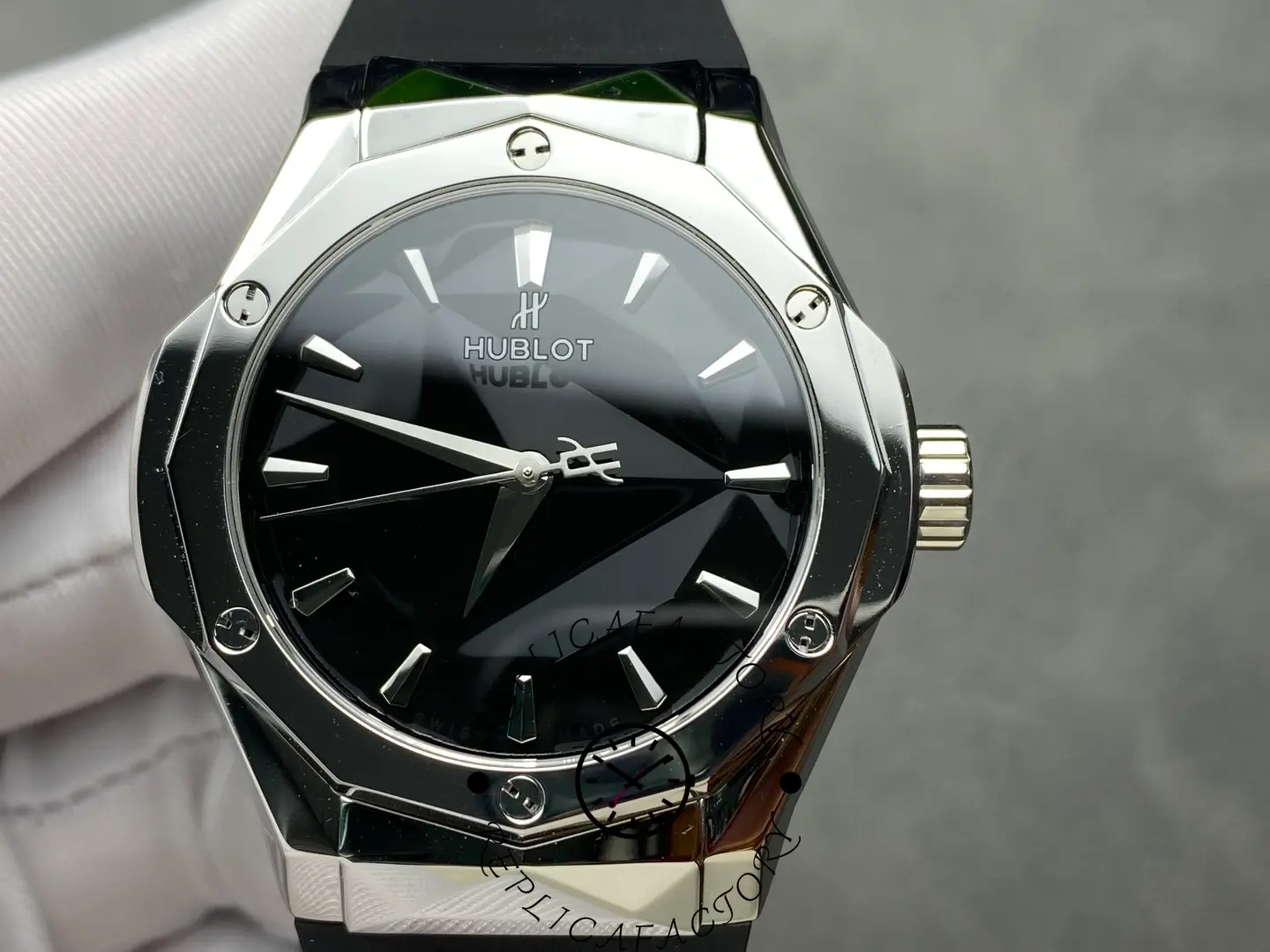 Close-up of Hublot 550.NS.1800.RX.ORL19 dial with polished indexes and geometric facets.