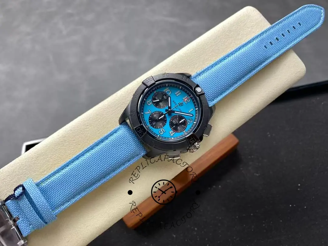 Full view of Breitling Avenger B01 42 SB0146101L1X1 with blue textile strap laid flat.