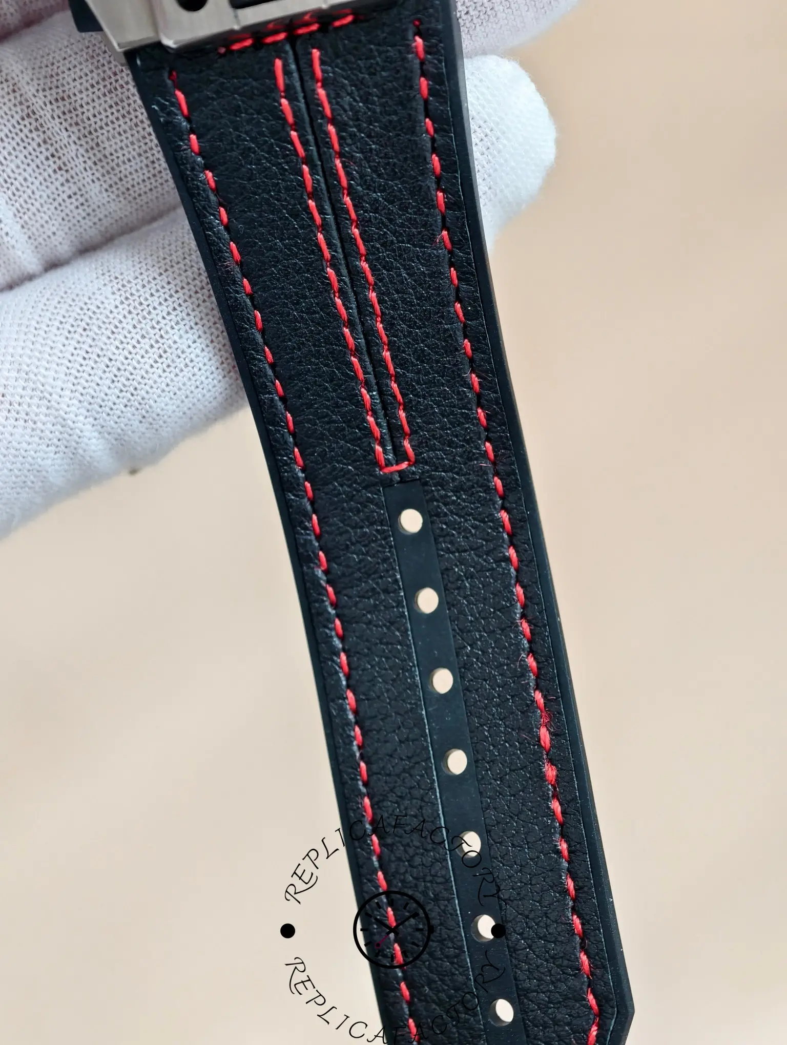 Strap detail of Hublot Big Bang Ferrari 401.NX.0123.VR replica with red stitching.