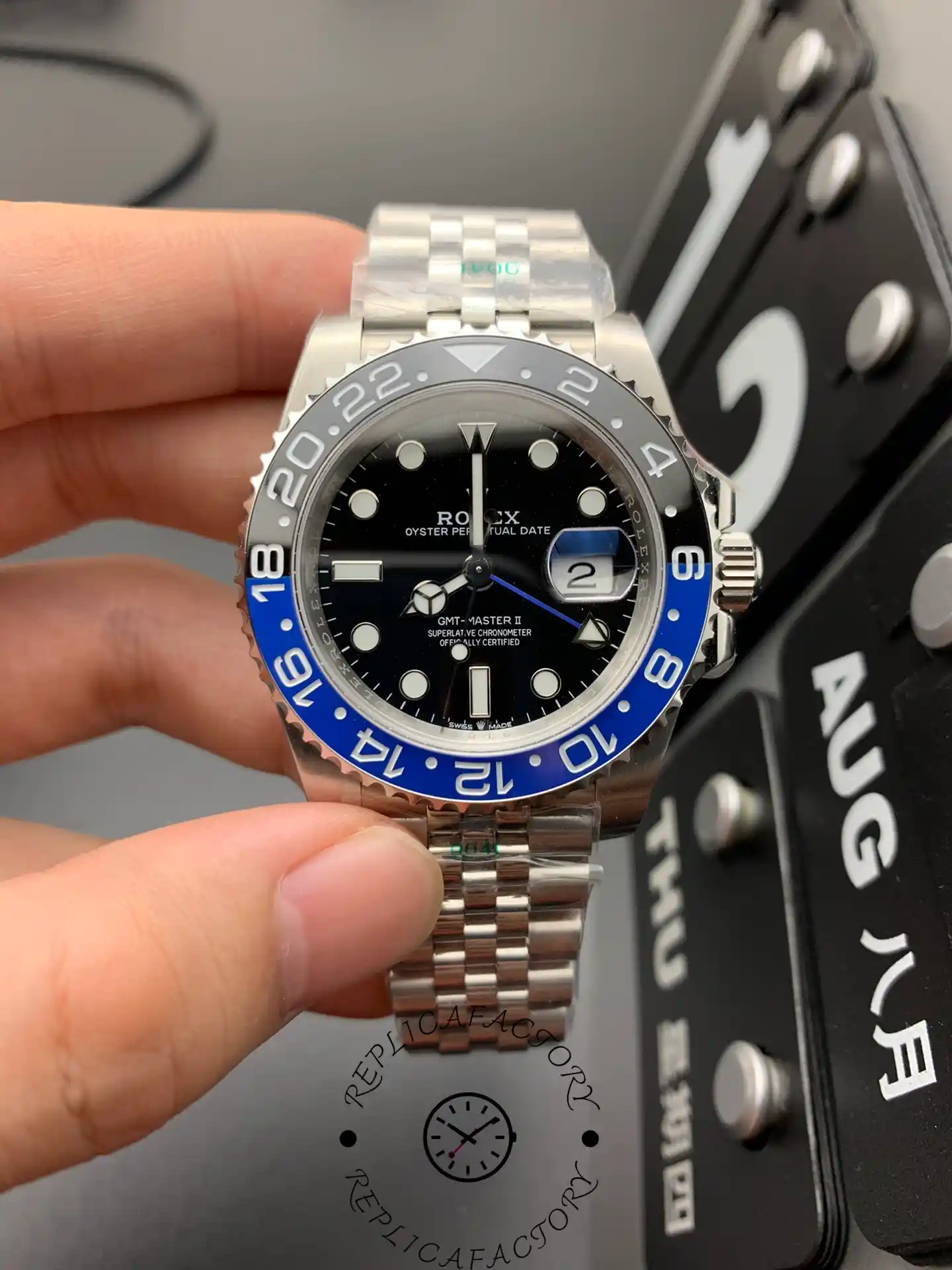 Front view of the Rolex GMT-Master II 126710BLNR-0002 with black dial, blue and black Cerachrom bezel, and Jubilee bracelet.