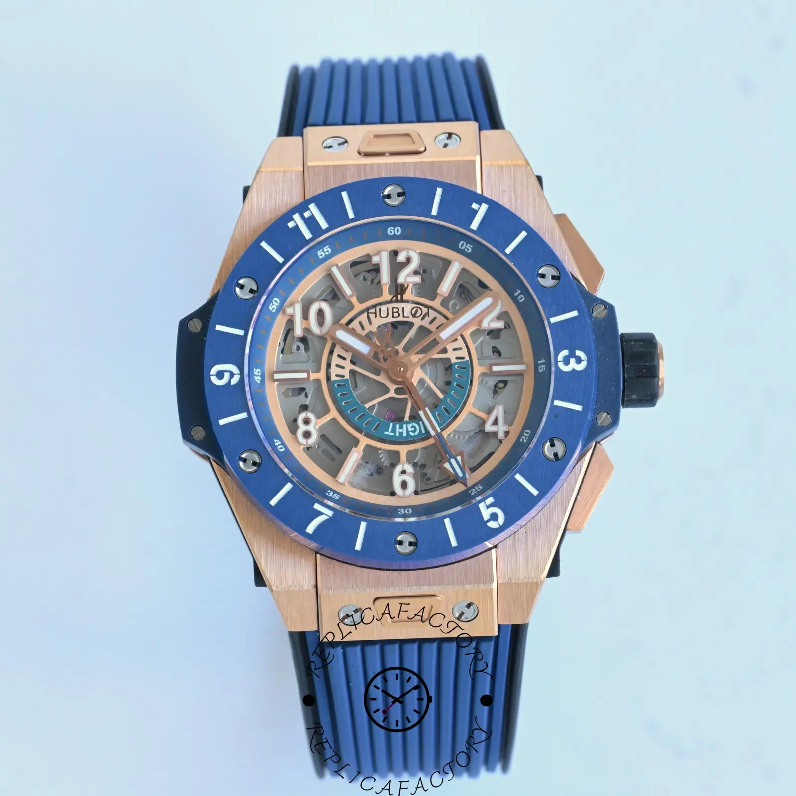 Top view of the Hublot 471.OL.7128.RX highlighting the rose gold case and blue rubber strap.