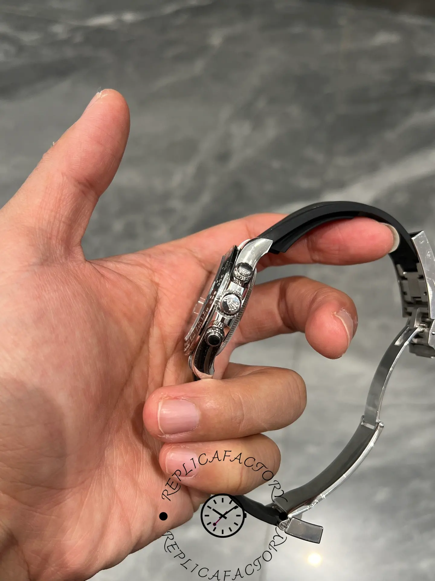 Side view of Rolex Daytona 126519LN showing chronograph pushers, crown, and case thickness.