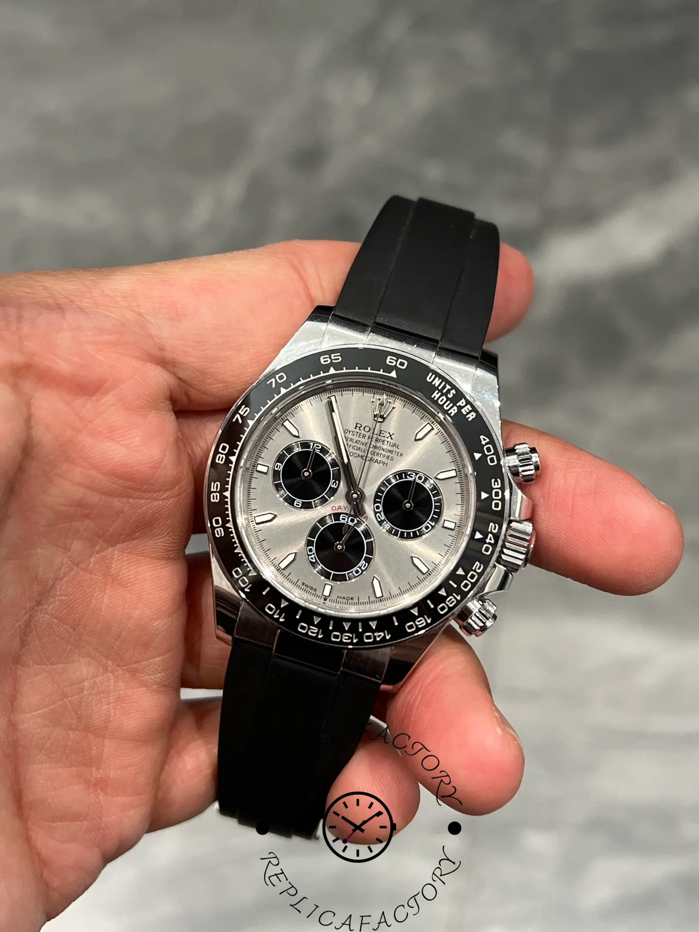Front view of Rolex Daytona 126519LN highlighting silver dial, ceramic bezel, and black Oysterflex strap.