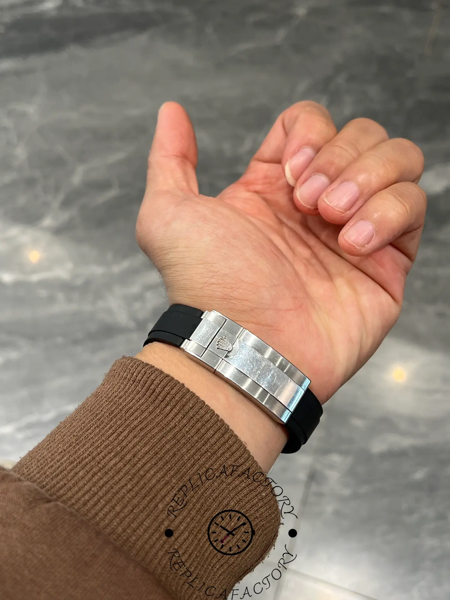 Back clasp view of Rolex Daytona 126519LN showing Oysterflex strap and engraved Rolex clasp.