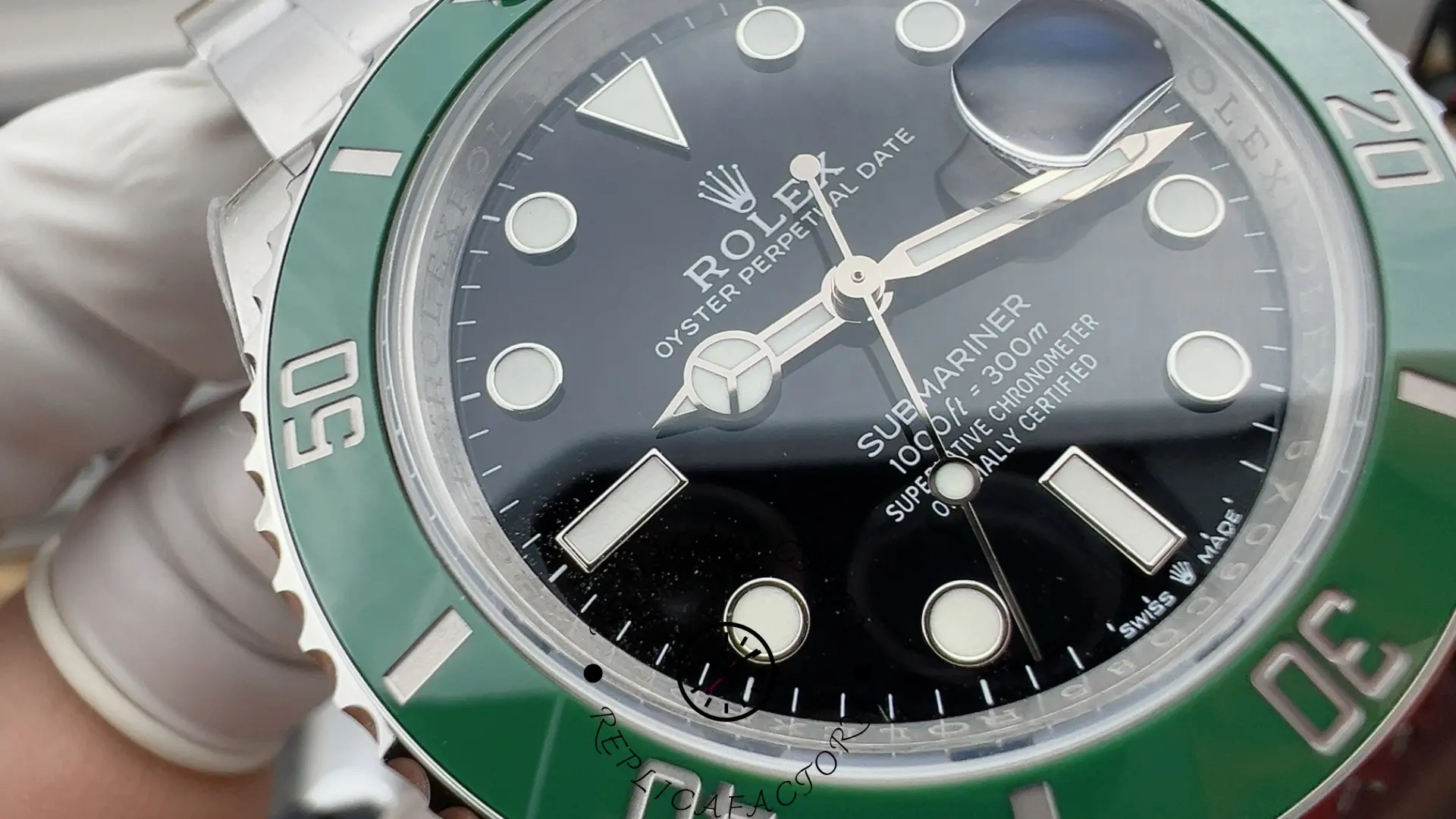 Macro view of the Rolex Submariner 126610LV dial markers and green ceramic bezel.
