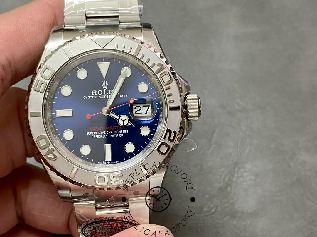 Hand-held view of Rolex Yacht-Master 126622 replica showing date window and bezel details.