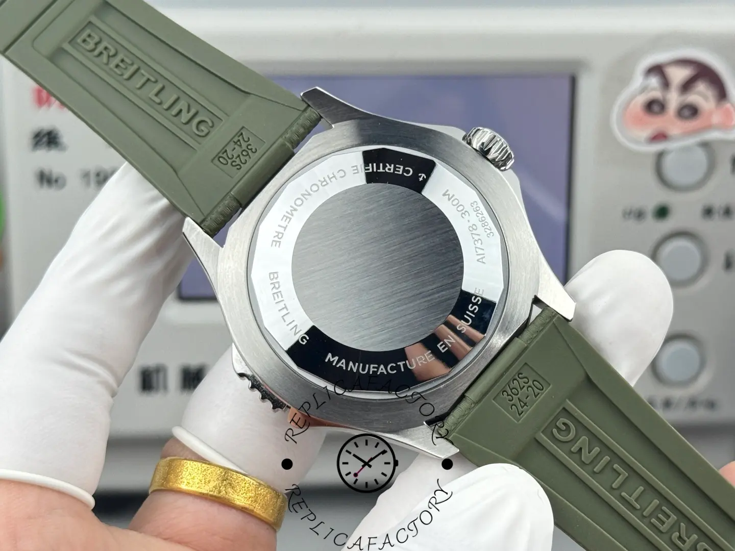 Caseback view of Breitling E10379D31L1S1 showing engraved rear cover and rubber strap.