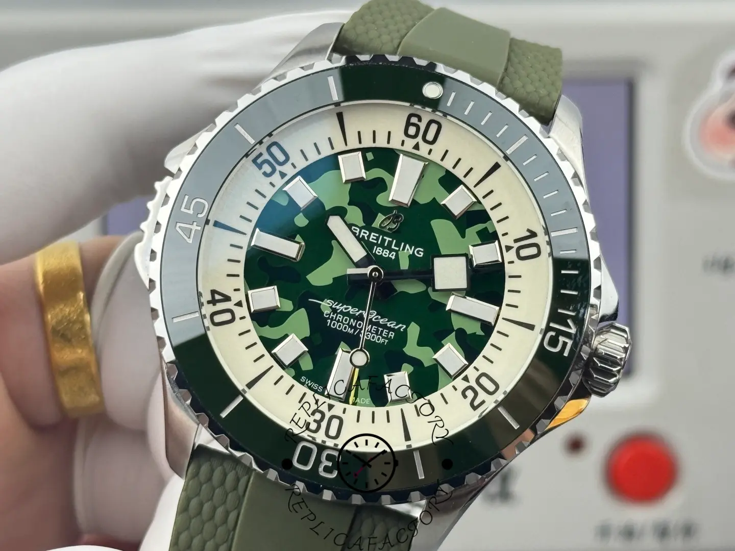 Detailed view of Breitling E10379D31L1S1 showing handset, camo dial, and inner scale.