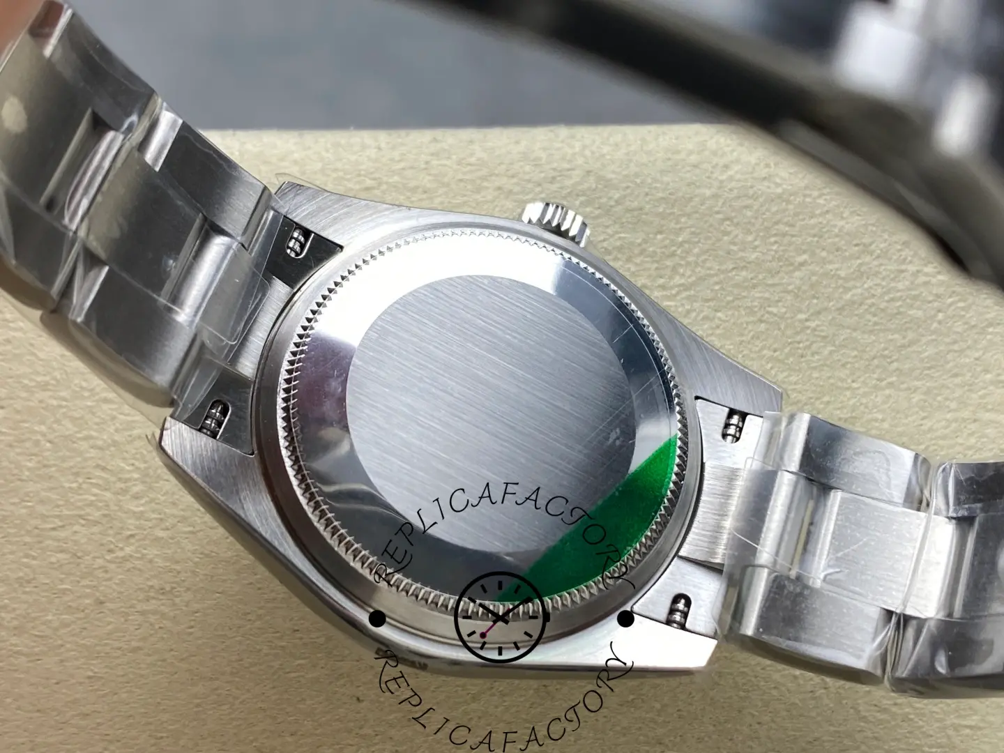 Back view of replica Rolex 277200 showing closed steel case back.