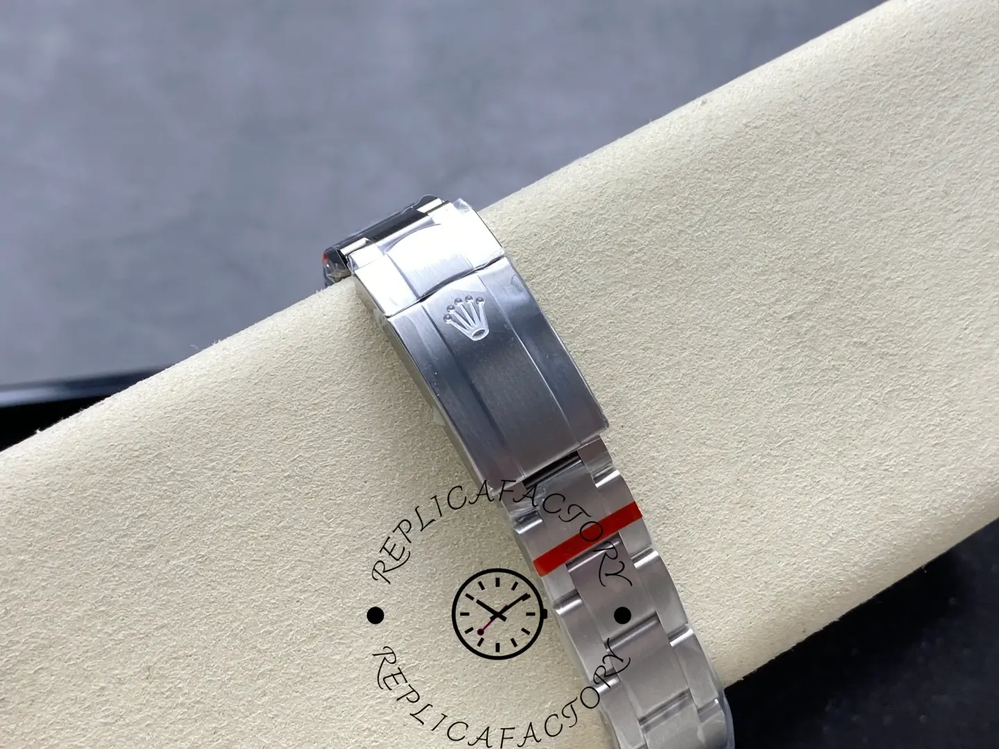 Clasp view of replica Rolex 277200 featuring folding clasp and engraved emblem.