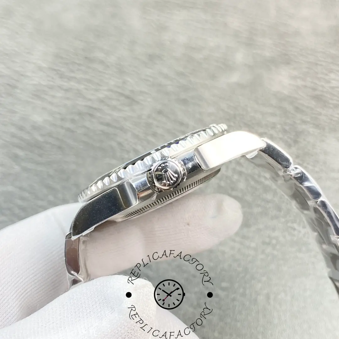 Side view of Rolex Submariner 114060 showing the crown with engraved Rolex logo.