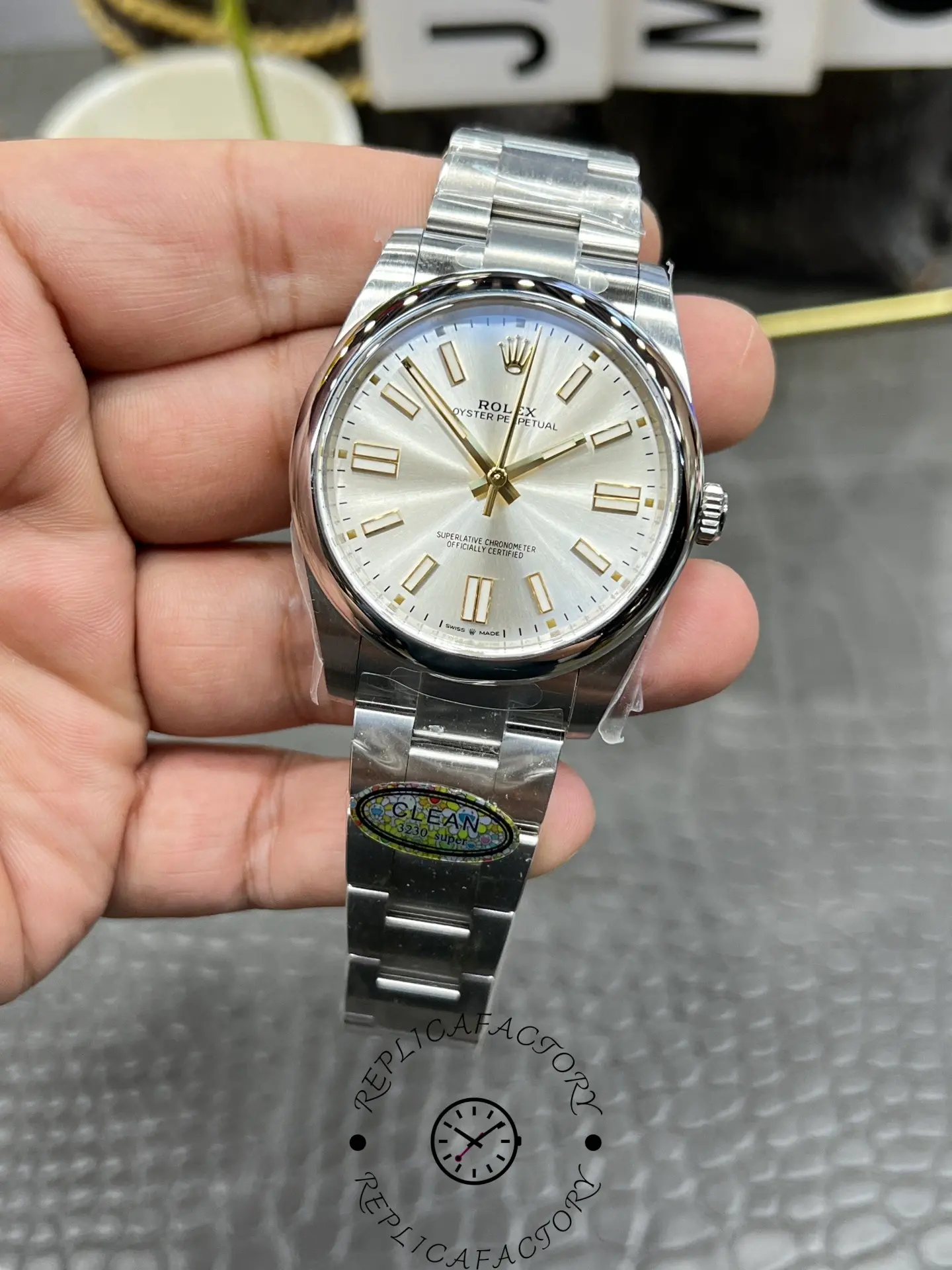 Full front view of Rolex M124300-0001 replica highlighting bracelet and dial alignment.