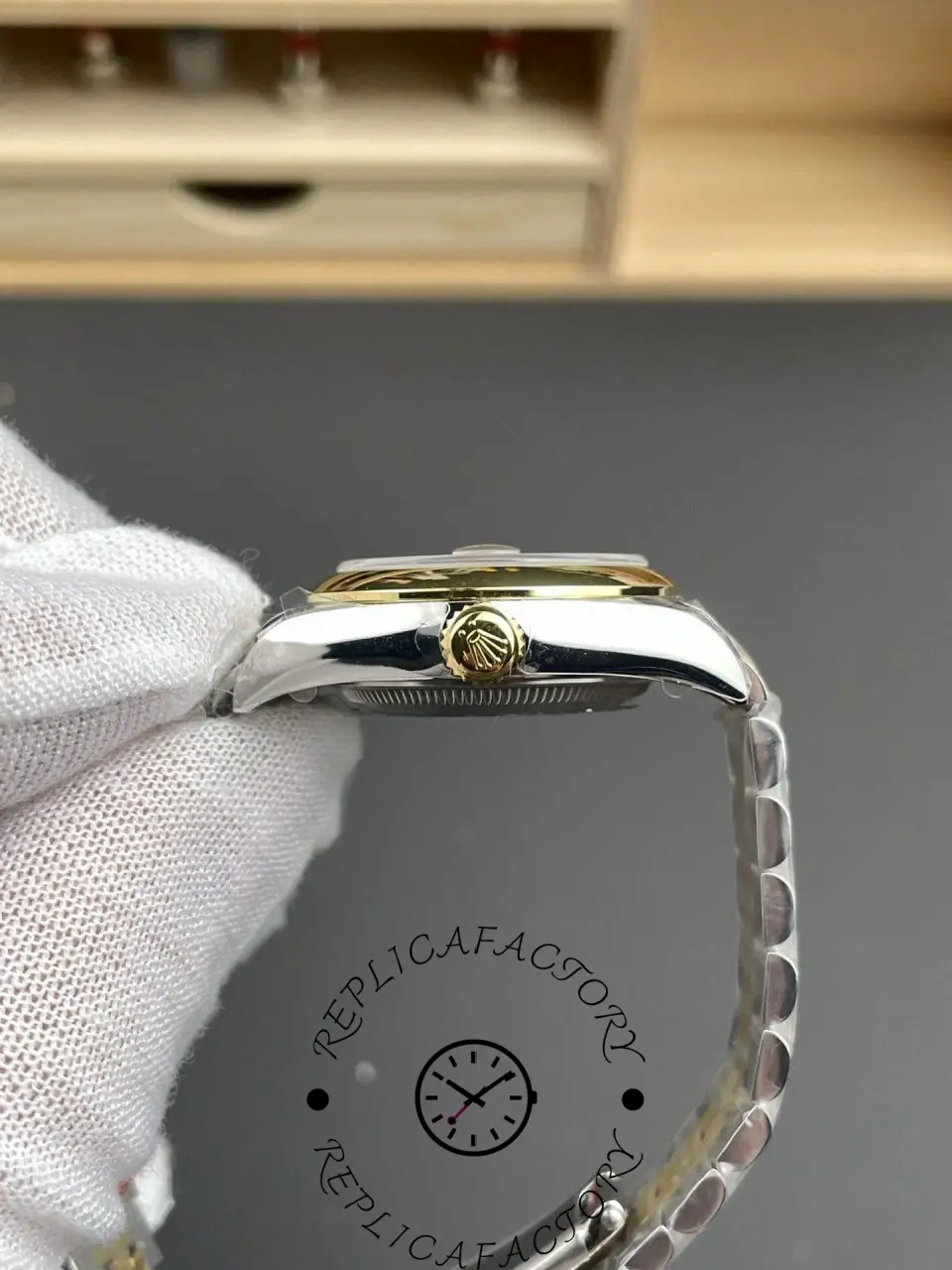 Crown-side view of Rolex 279163-0005 replica with gold crown and case curvature.