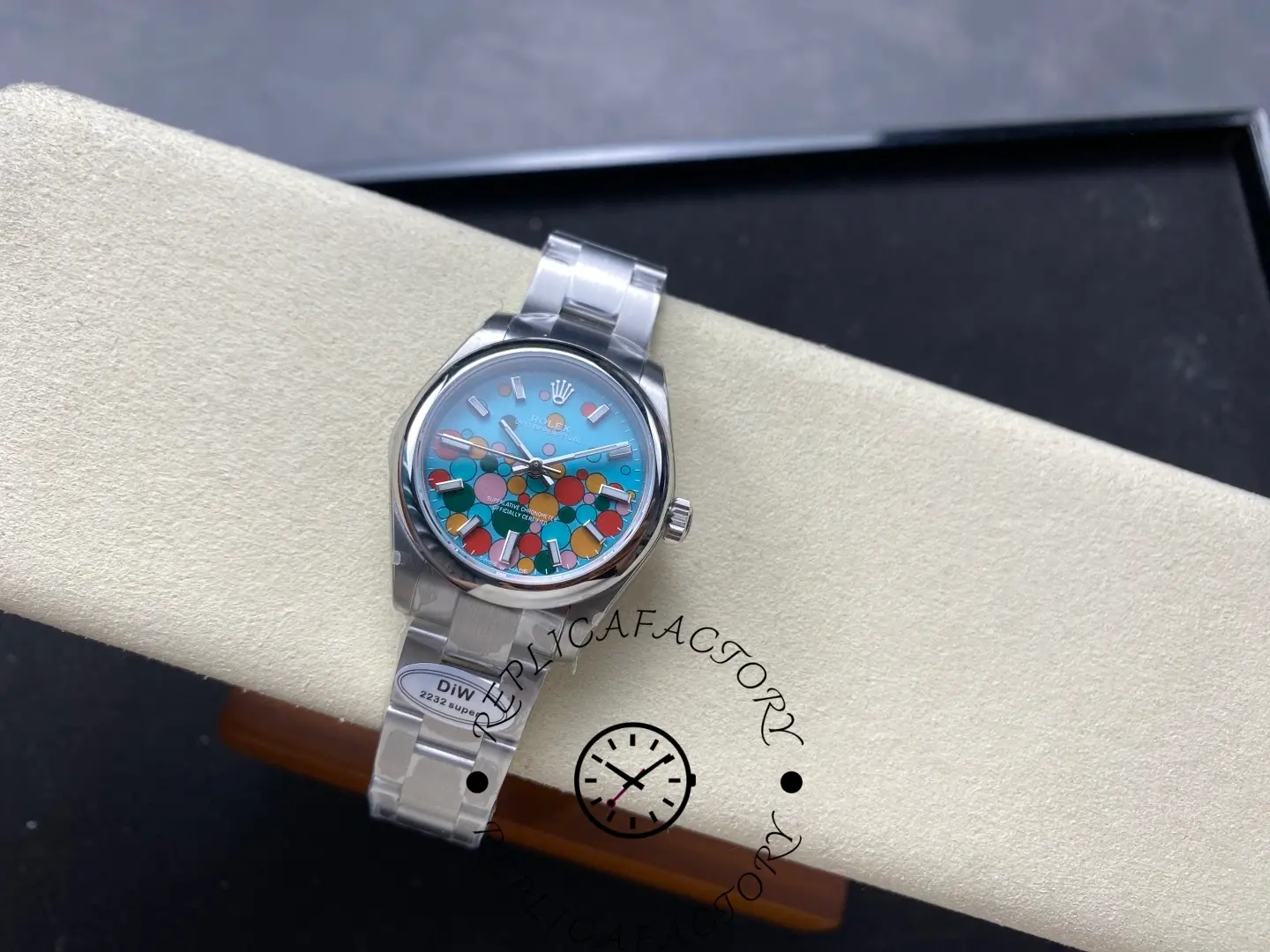 Top-angle image of replica Rolex 277200 with turquoise bubble dial.