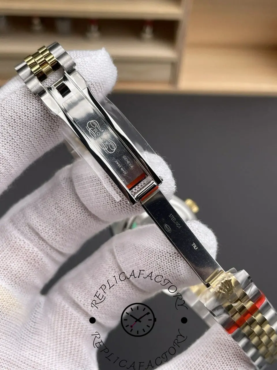 Inside clasp view of Rolex replica 279163-0005 showing engravings and folding mechanism.