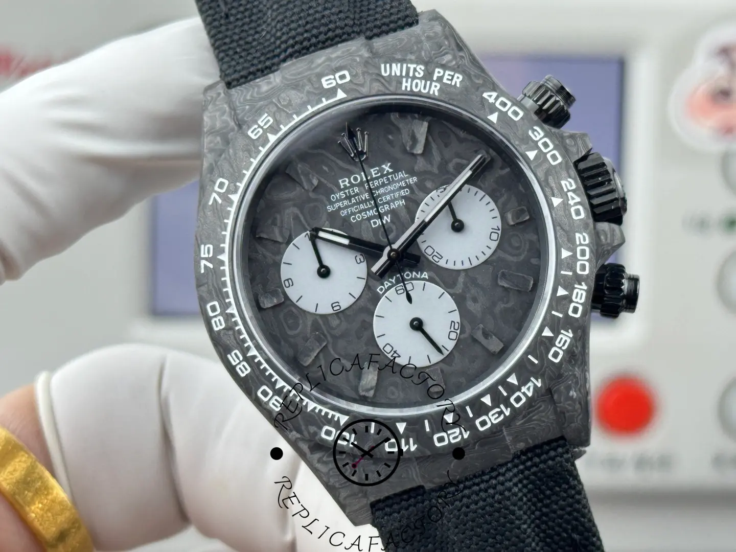 Detailed view of DiW Daytona DW carbon dial pattern and markers.