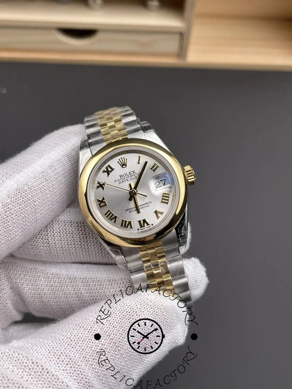 Angled view of Rolex Lady-Datejust 279163-0005 replica highlighting Roman numerals and date window.