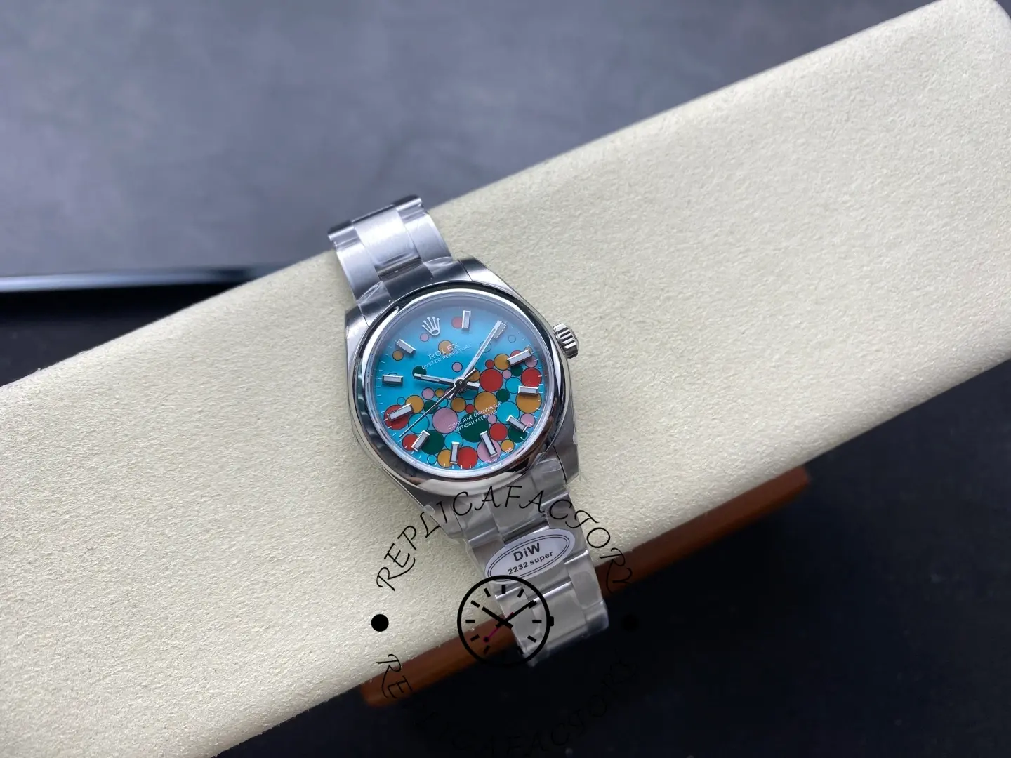 Full display of replica Rolex 277200 on cushion showing entire watch layout.