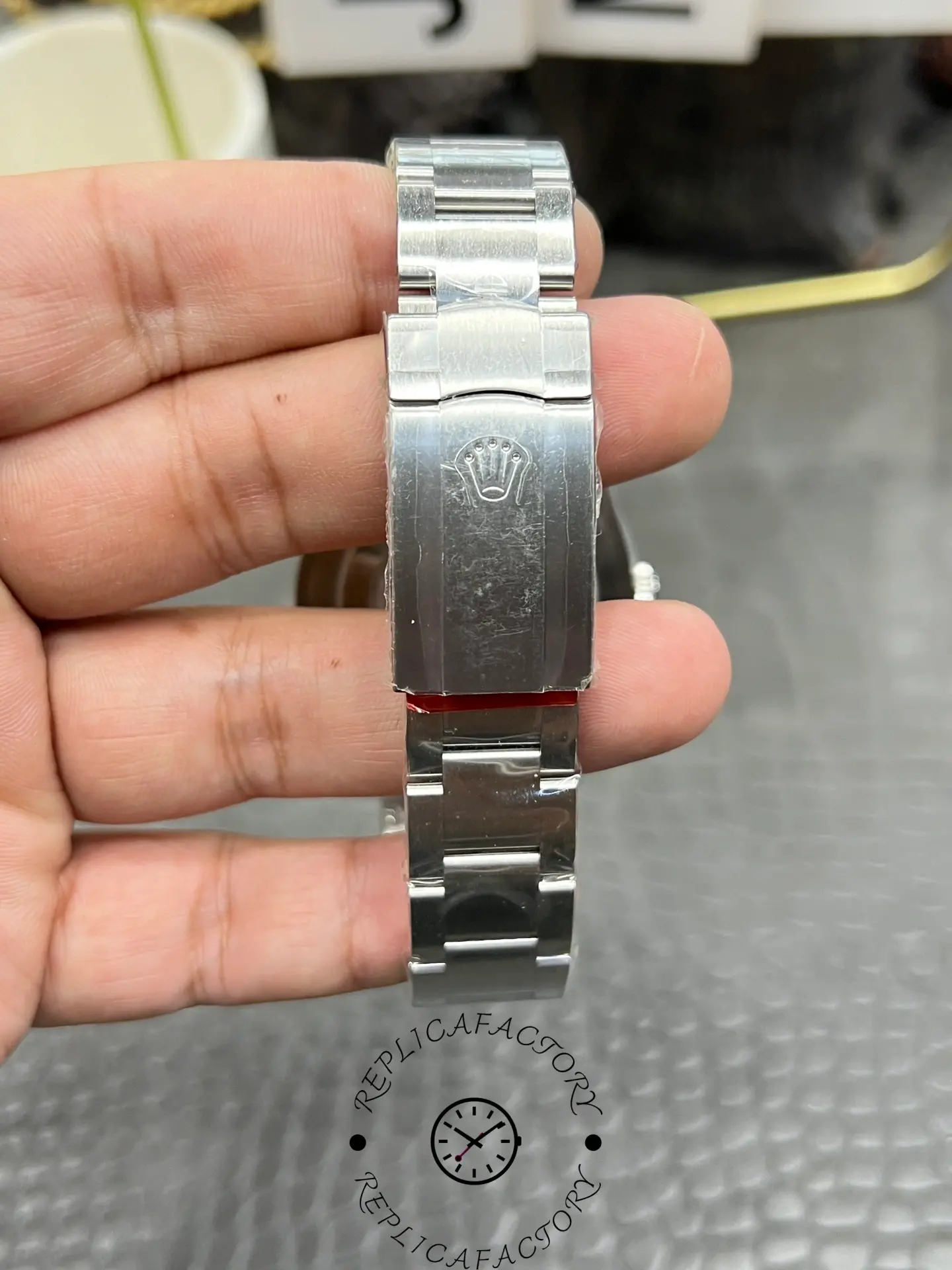 Clasp view of the Rolex Oyster Perpetual 41 M124300-0001 replica showing engraved Rolex crown logo.