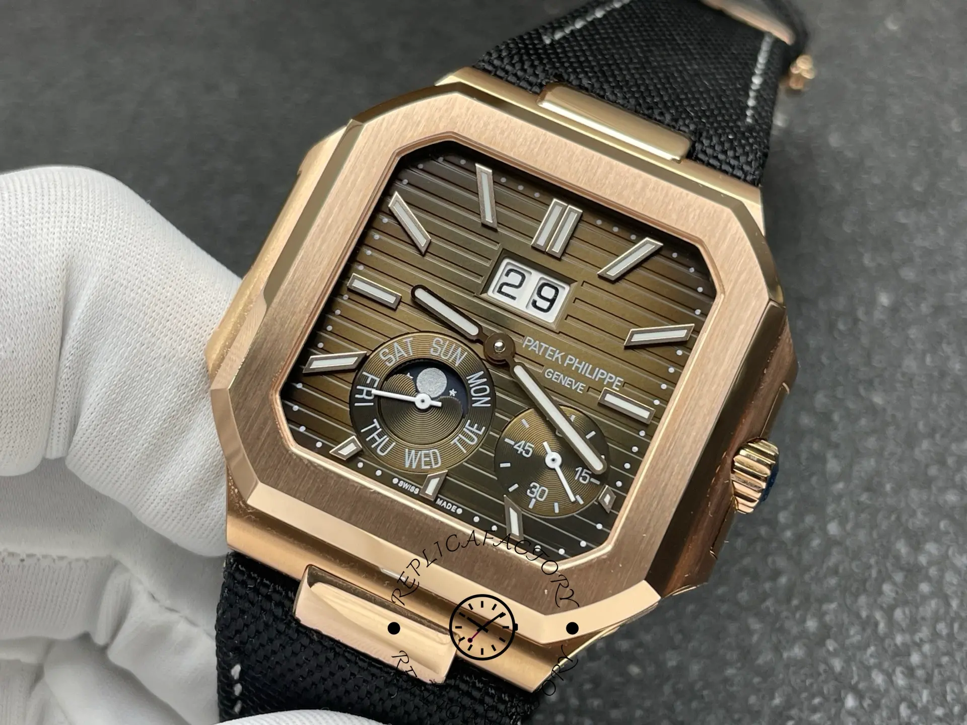 Angled front shot of Patek Philippe 5822R replica emphasizing brushed rose-gold case.