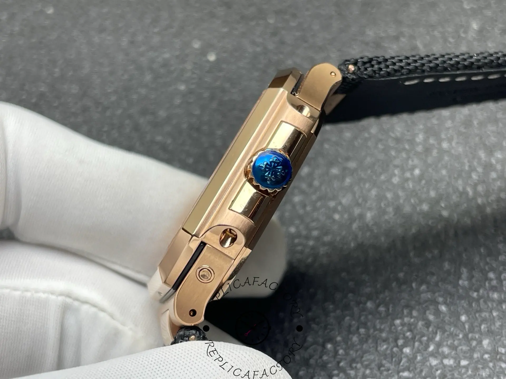 Side view of 5822R replica showing crown with blue accent and case edges.