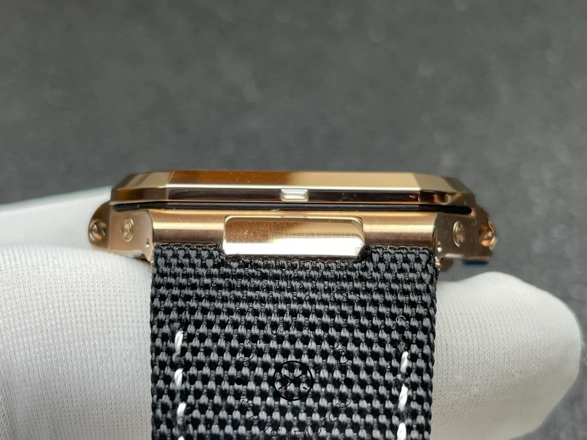 Top-side angle of Patek Philippe 5822R replica focusing on strap attachment.