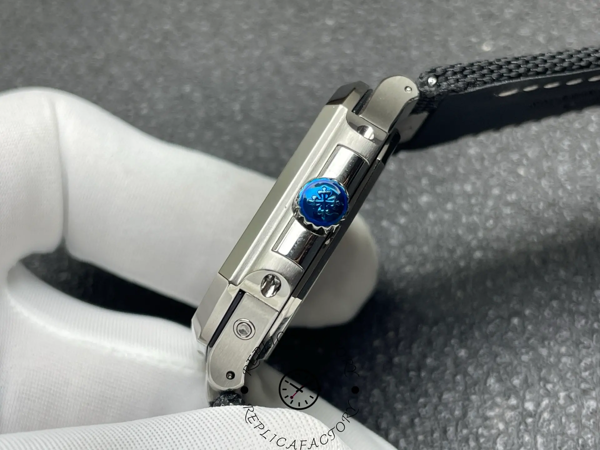 Crown view of Patek Philippe 5822P with Calatrava-engraved crown.