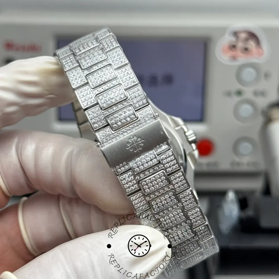 Bracelet view of Nautilus 5711 Custom Micro-Diamond Blue Dial replica featuring full diamond links.