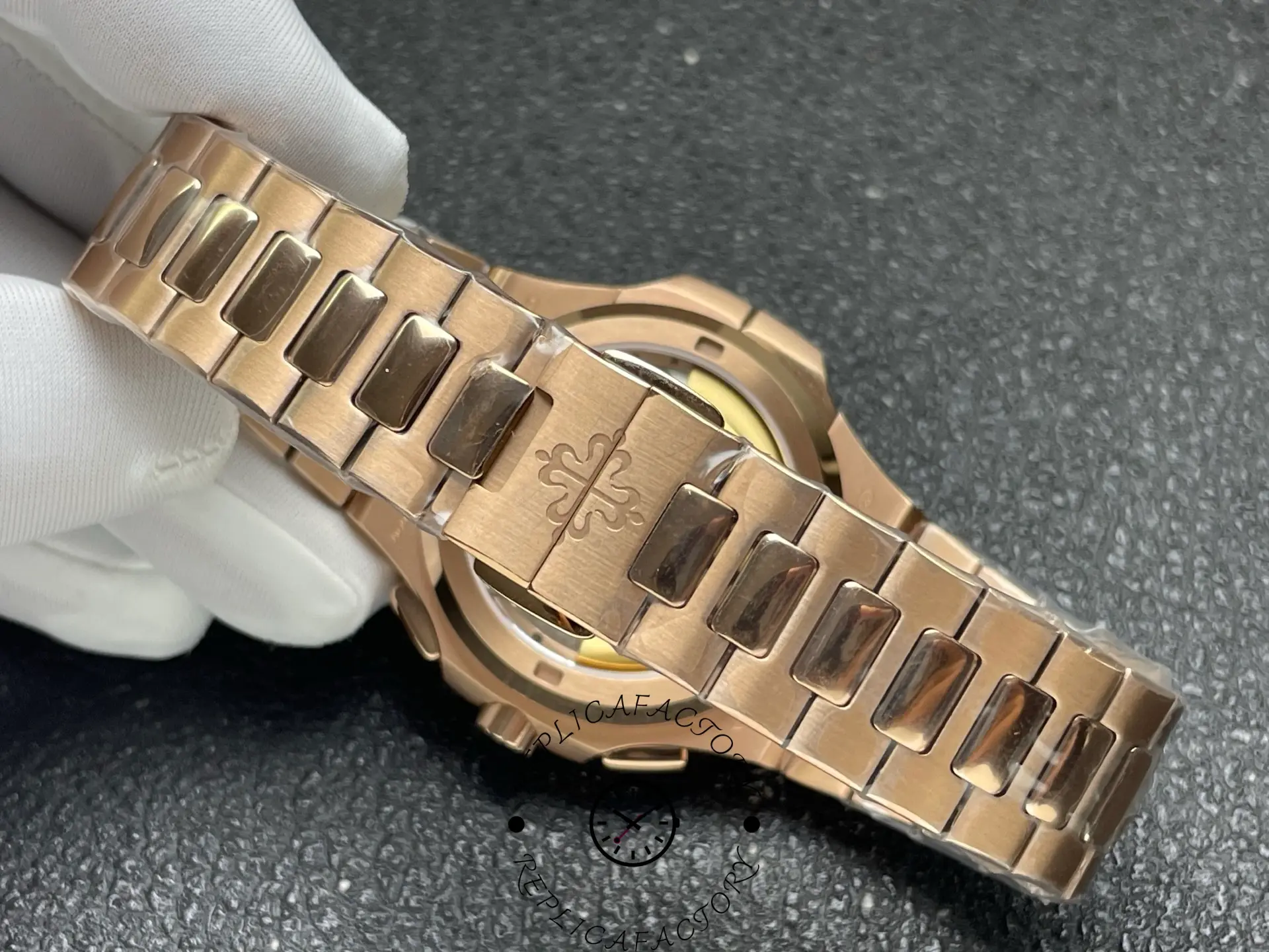 Bracelet view of Patek Philippe 5990/1R-001 replica showing rose gold links.