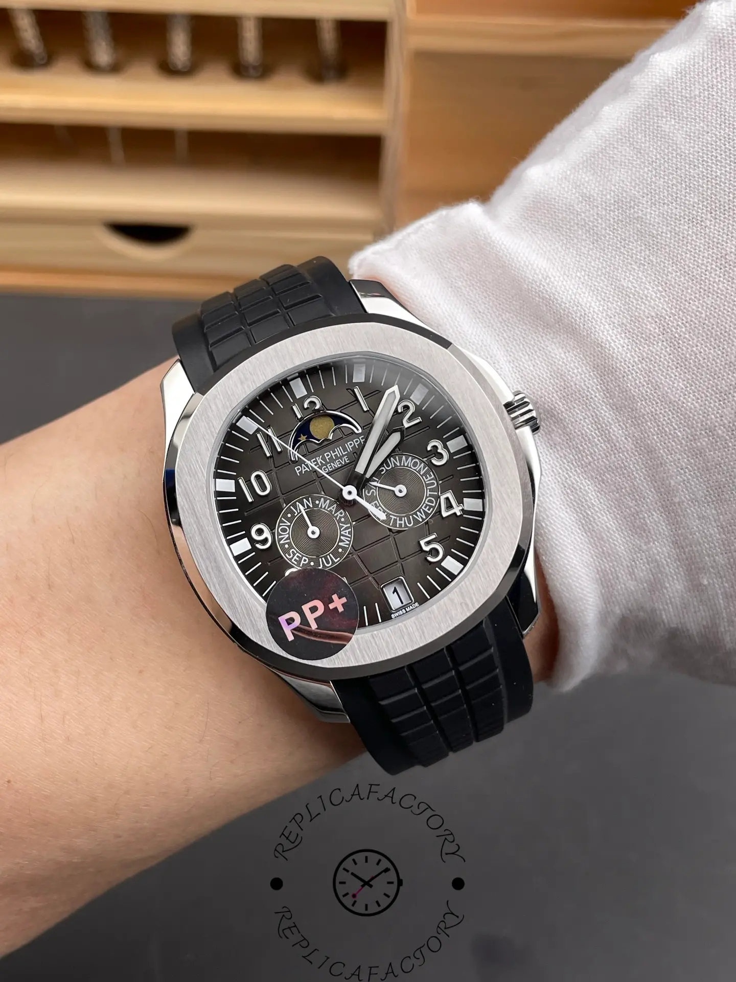 Wrist shot of the Aquanaut 5261R replica on black rubber strap.