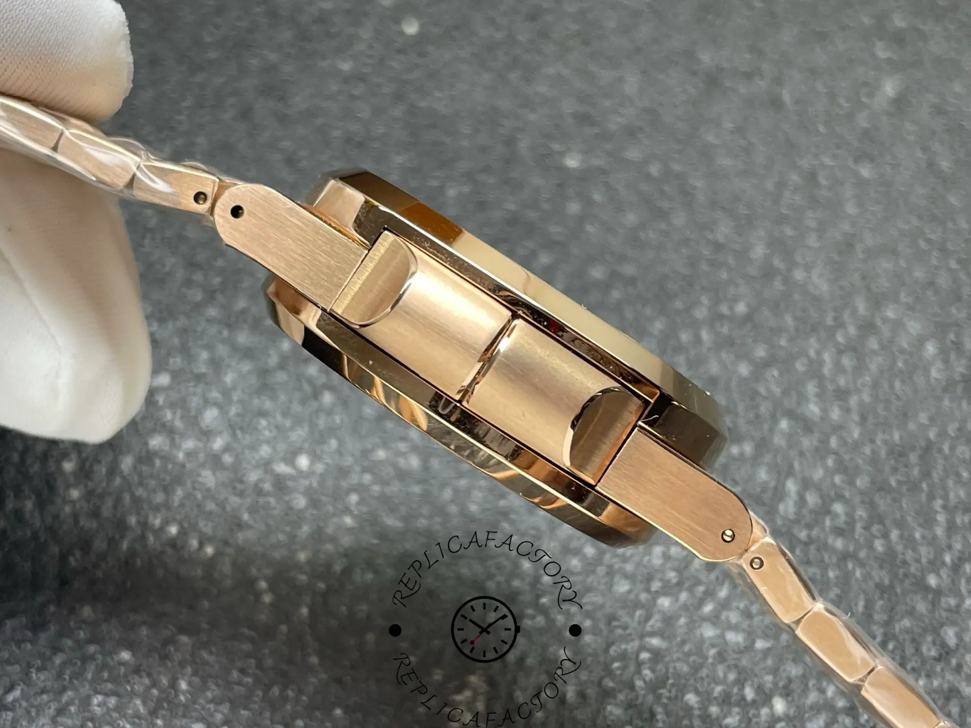 Side profile of Patek Philippe 5990/1R-001 replica showing bracelet link structure.