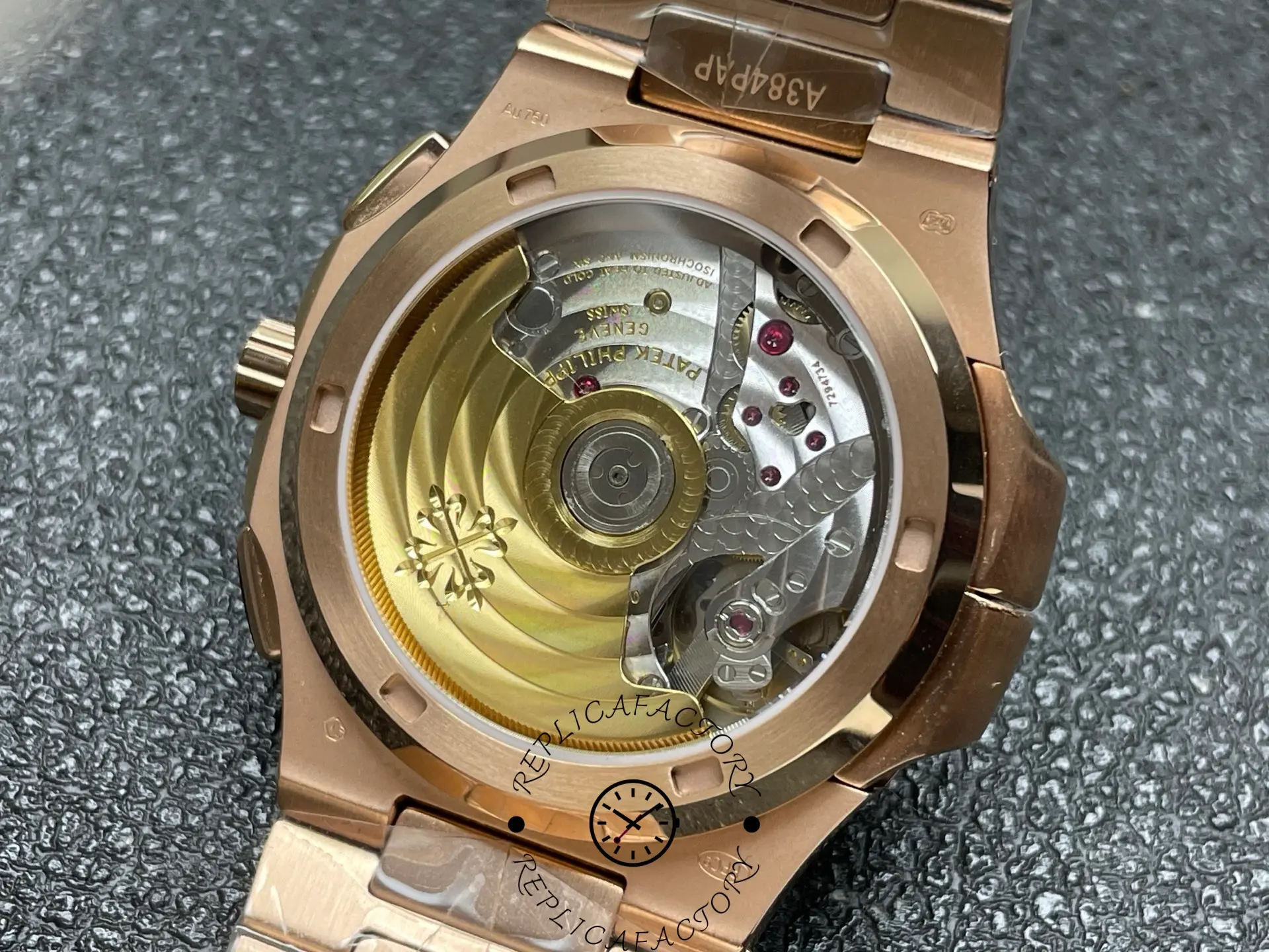 Display back of Patek Philippe 5990/1R-001 replica showing automatic rotor.