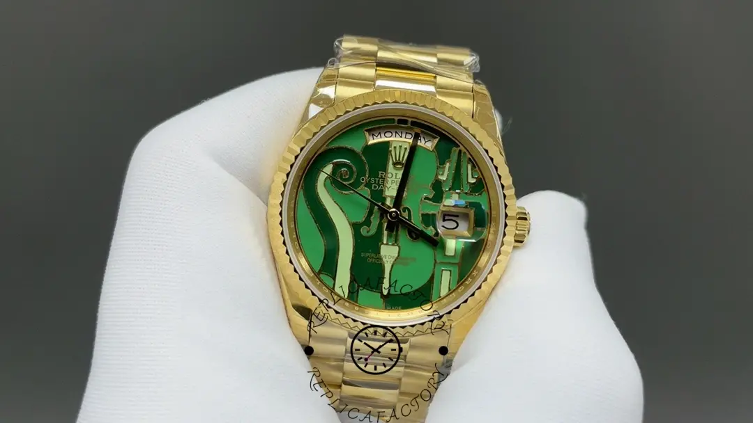 Close view of Rolex 128238-VIO dial with day window and ornate green pattern.