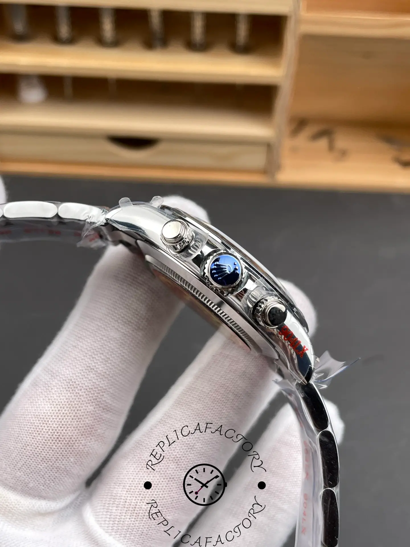 Side profile of Rolex Daytona 116509-0073 replica showing crown and pushers.