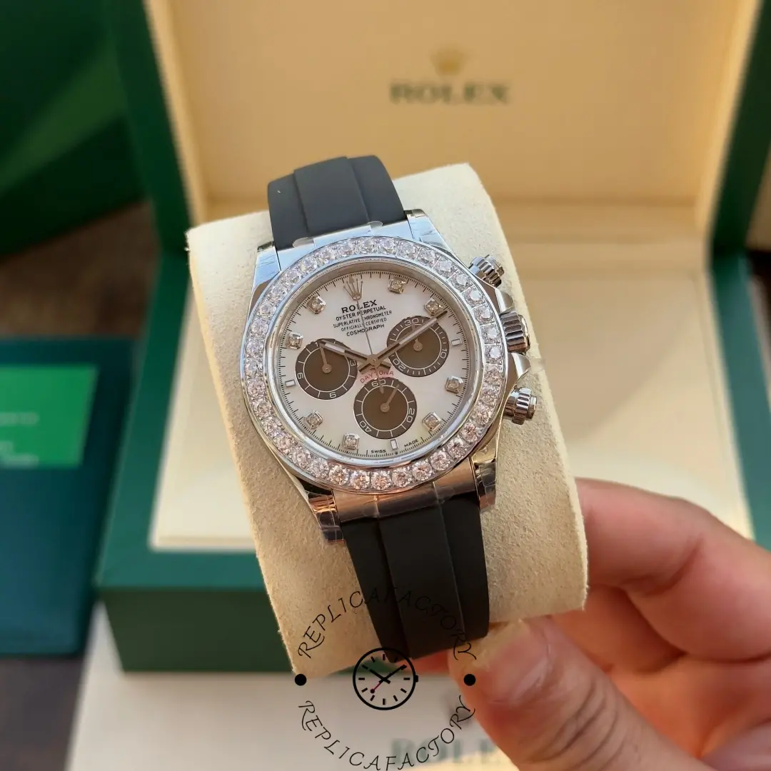 Hand-held Rolex Daytona 126589RBR with white MOP dial and brown subdials.