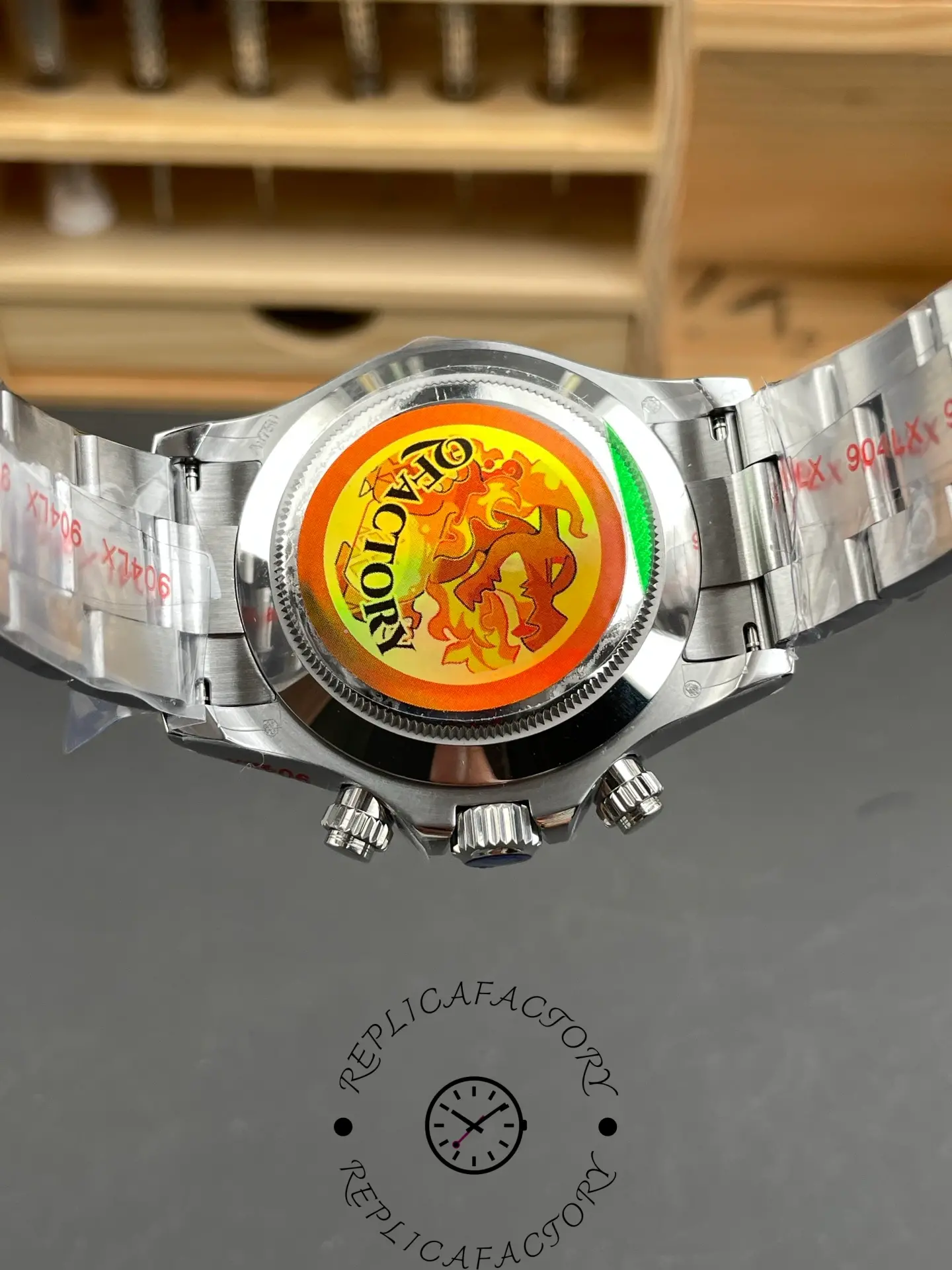 Rear case view of the Rolex Daytona 116509-0073 replica showing colorful factory sticker.